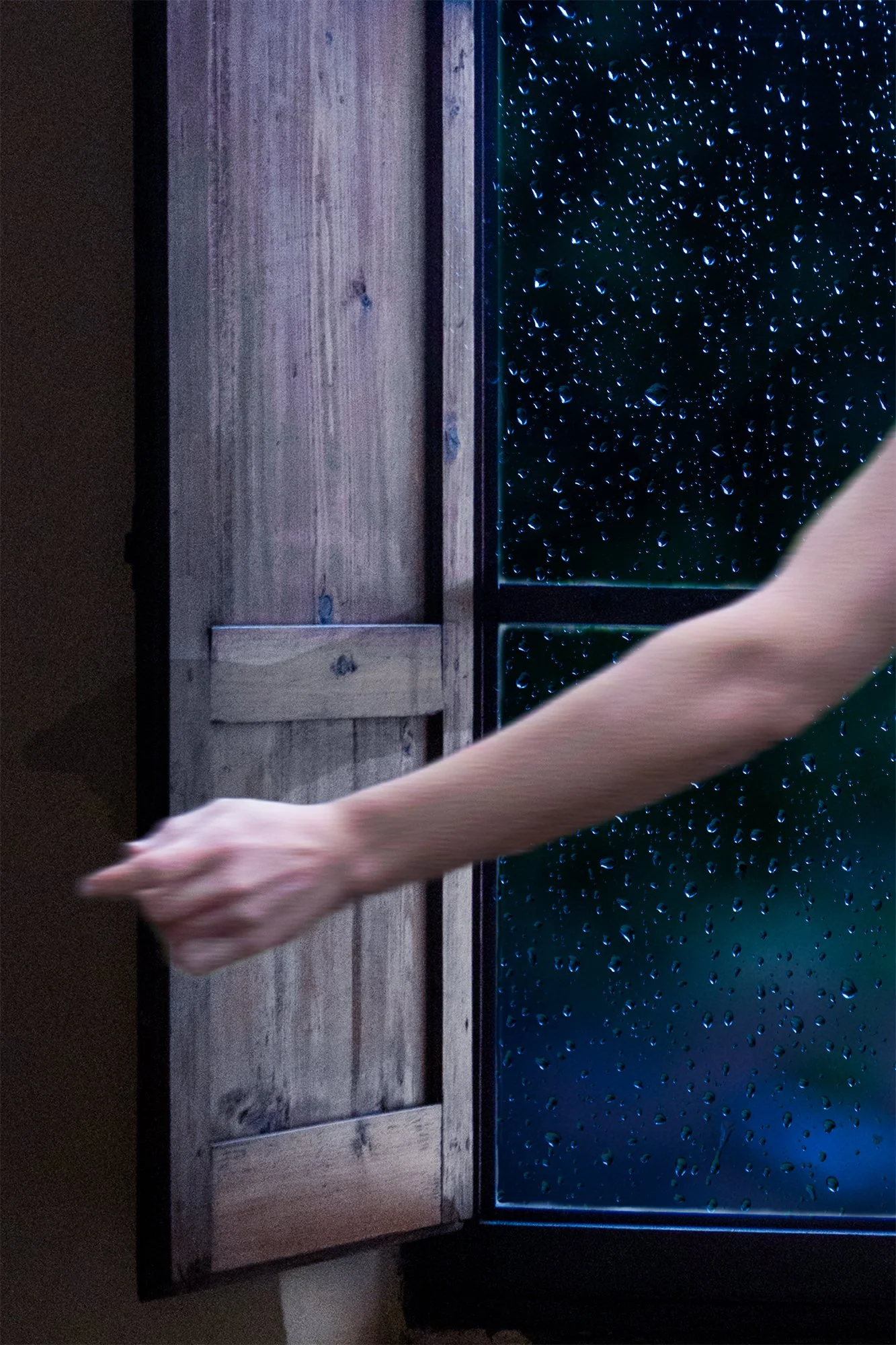 rainy window with shutter