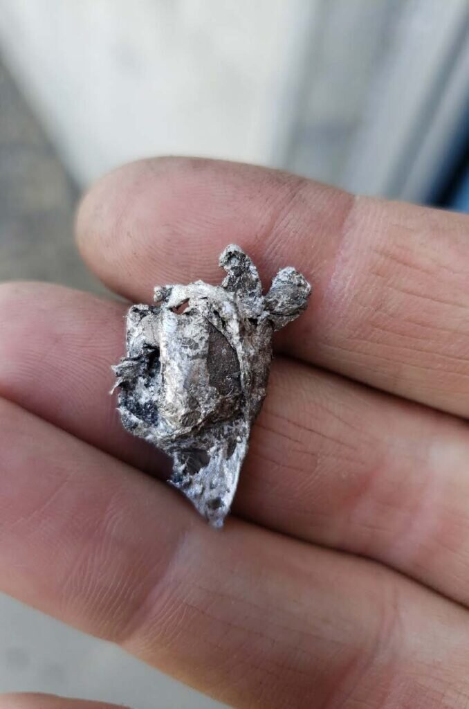 Metal melted from the lightning strike.