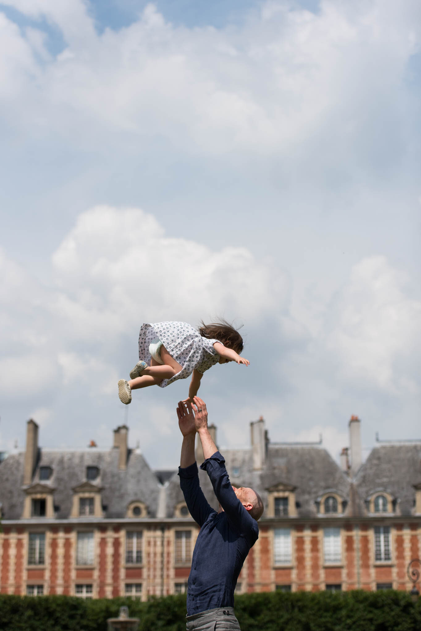    ‘Paris/NYC’ Book ‘Edition Lammerhuber’    Throwing daughter in air. Place des Vosges, Paris 