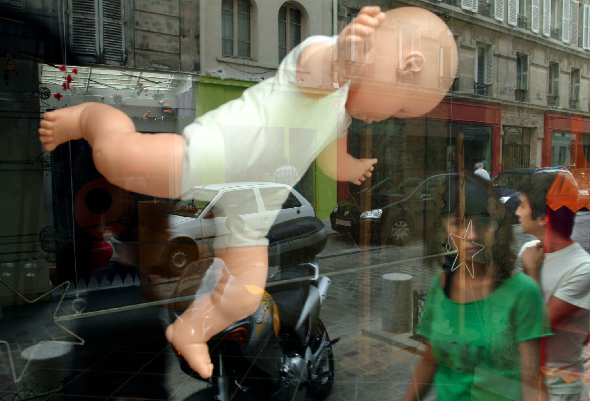    ‘Paris/NYC’ Book ‘Edition Lammerhuber’    Baby floating in store window. Rue des Rosiers, Marais Paris 