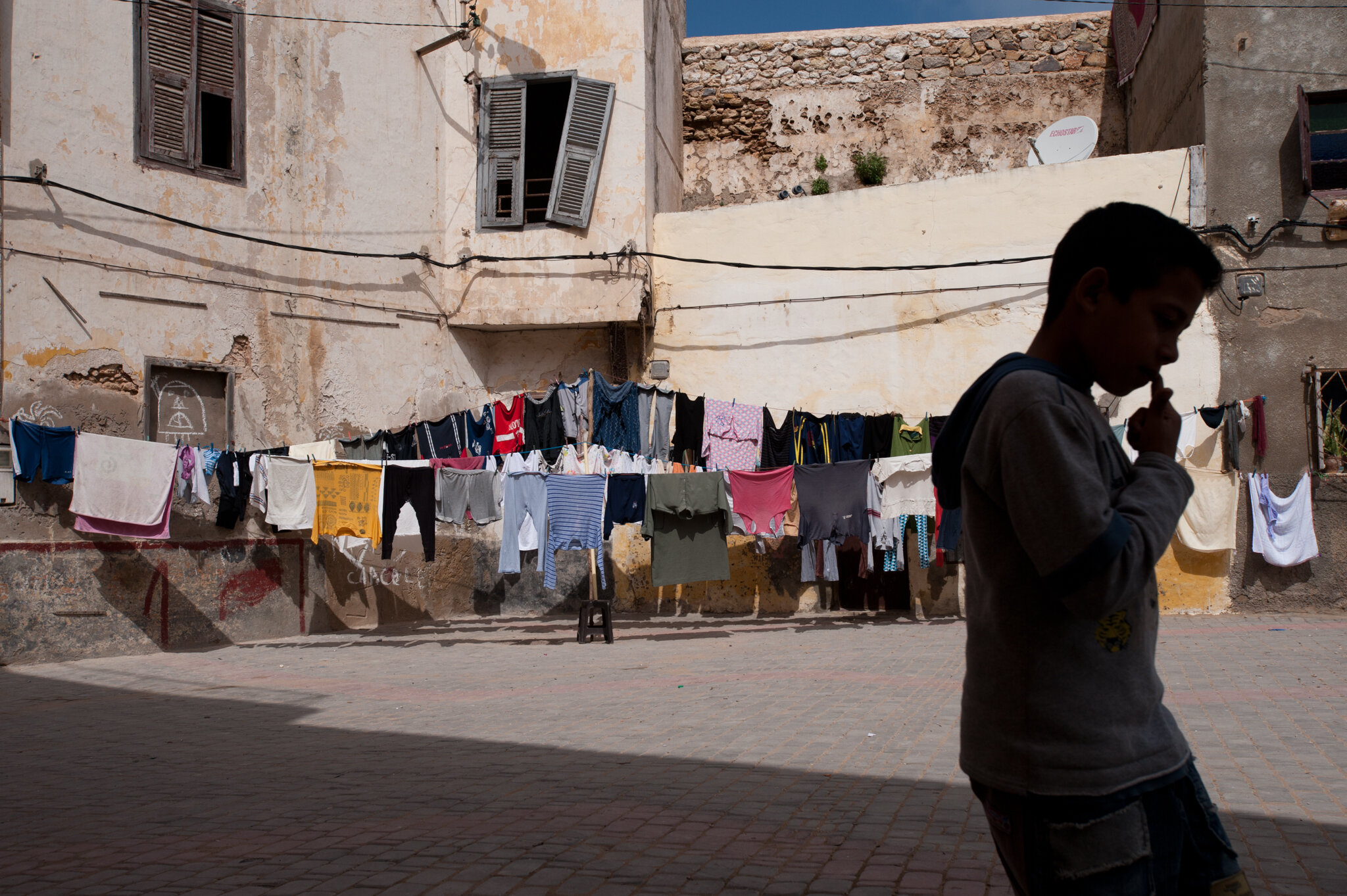    Morocco - El Jadida    Boy walking through old medina 