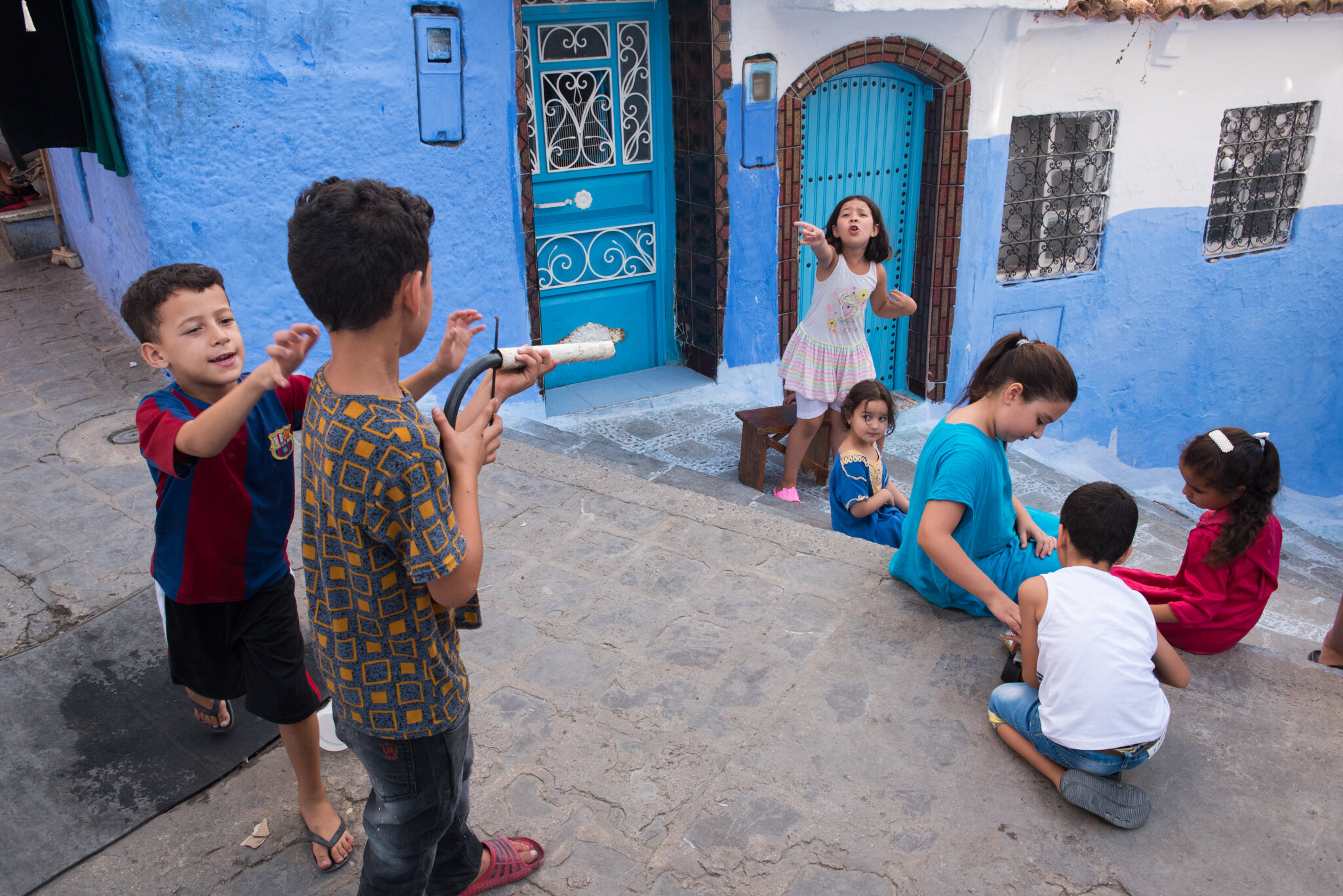    Morocco - Chefchaouen     Kids playing. He takes aim. She yells ‘stop’! 