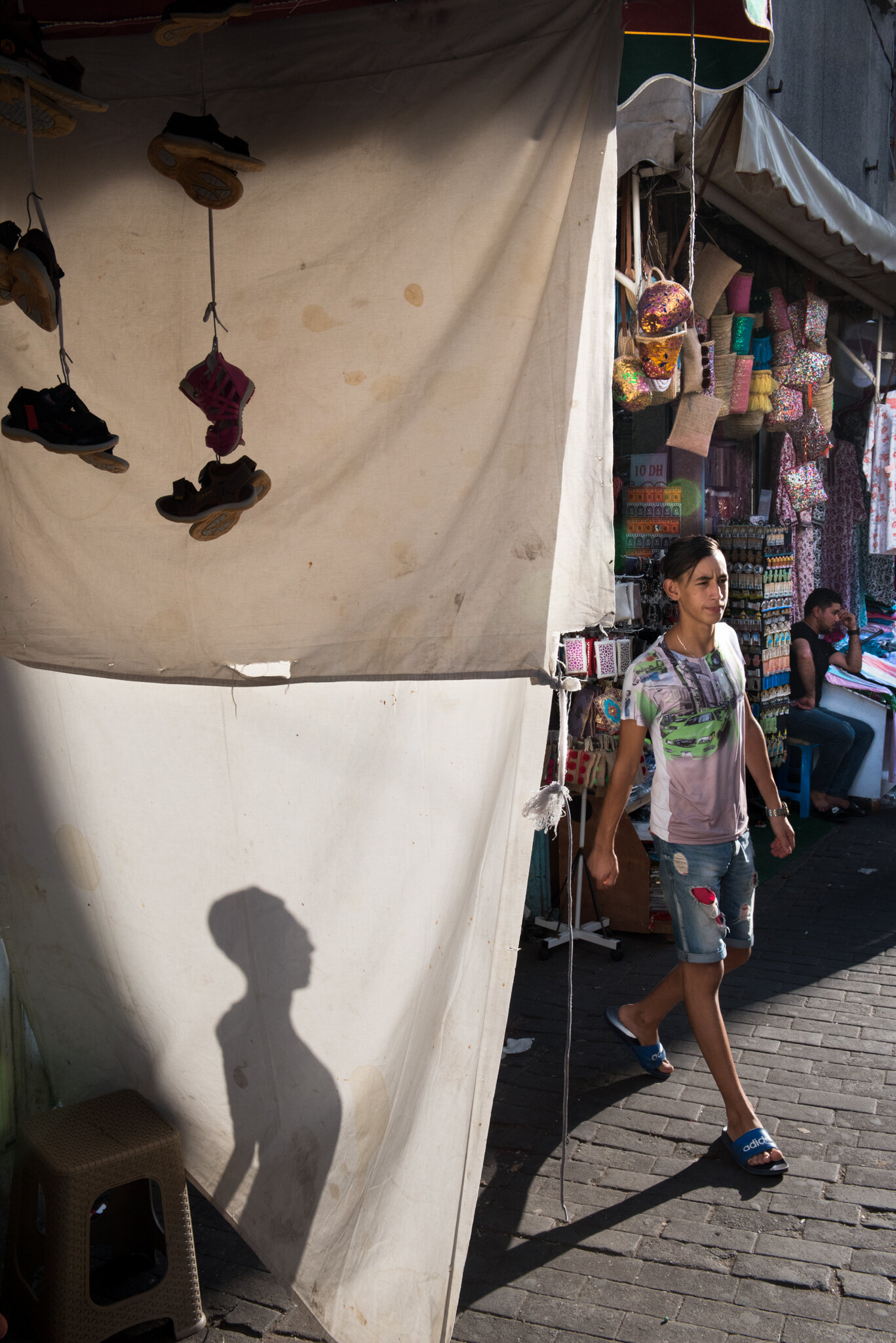    Morocco - Tanger     Shadow of boy warped on fabric 