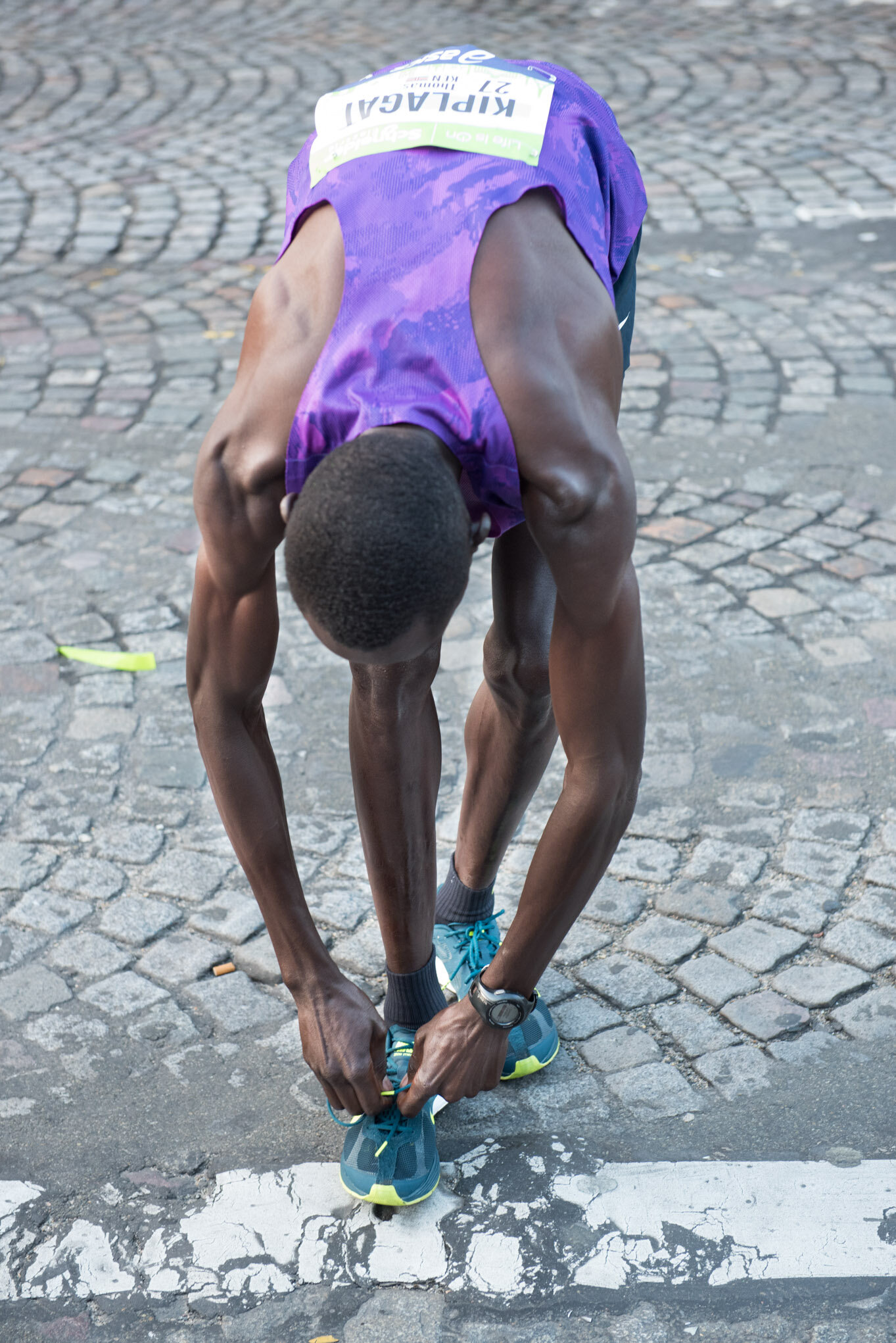    Paris Marathon for Schneider Electric    Kenyan runner stretching 