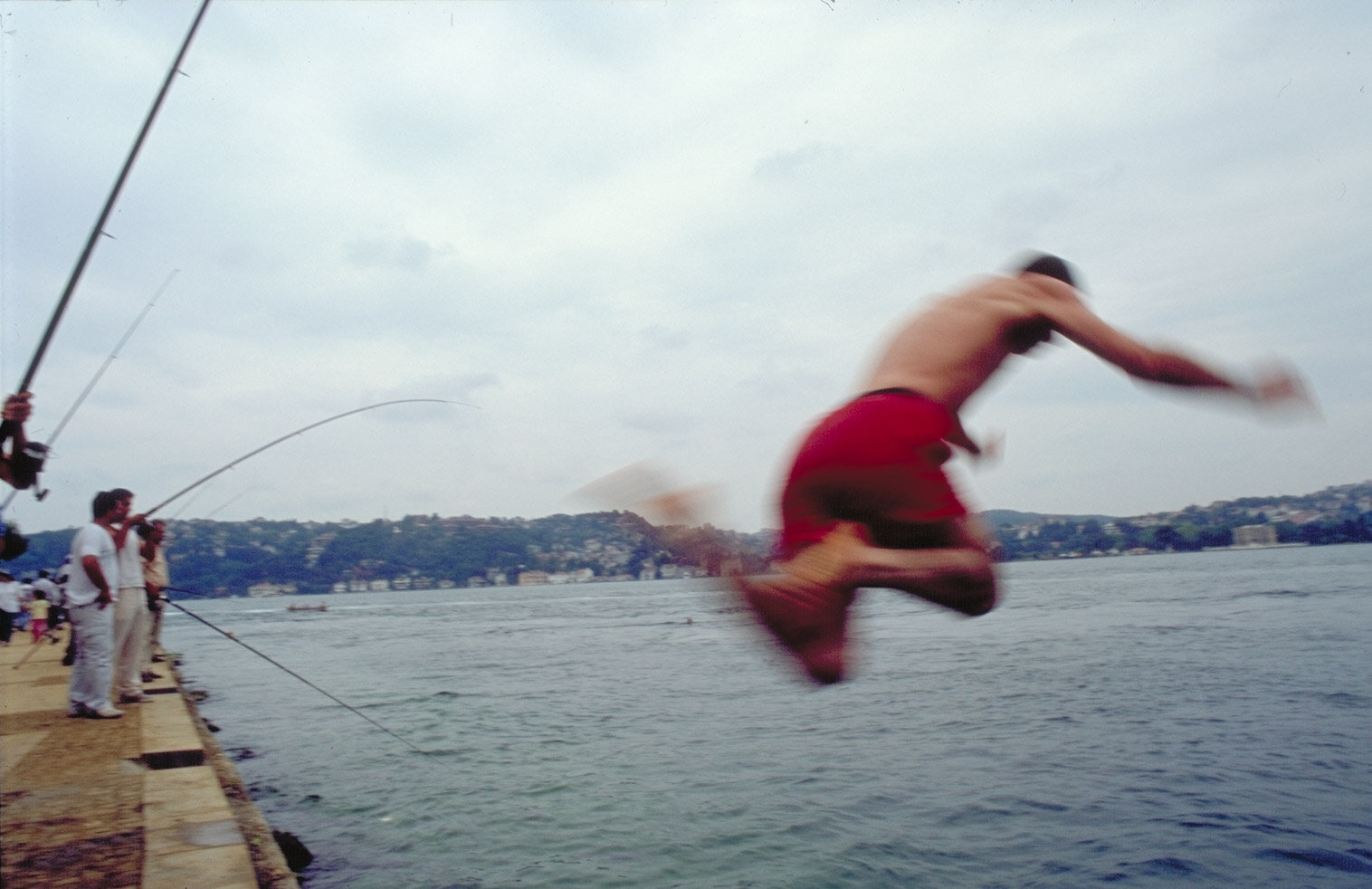    Istanbul, Turkey    Boy jumping into Bosporus 