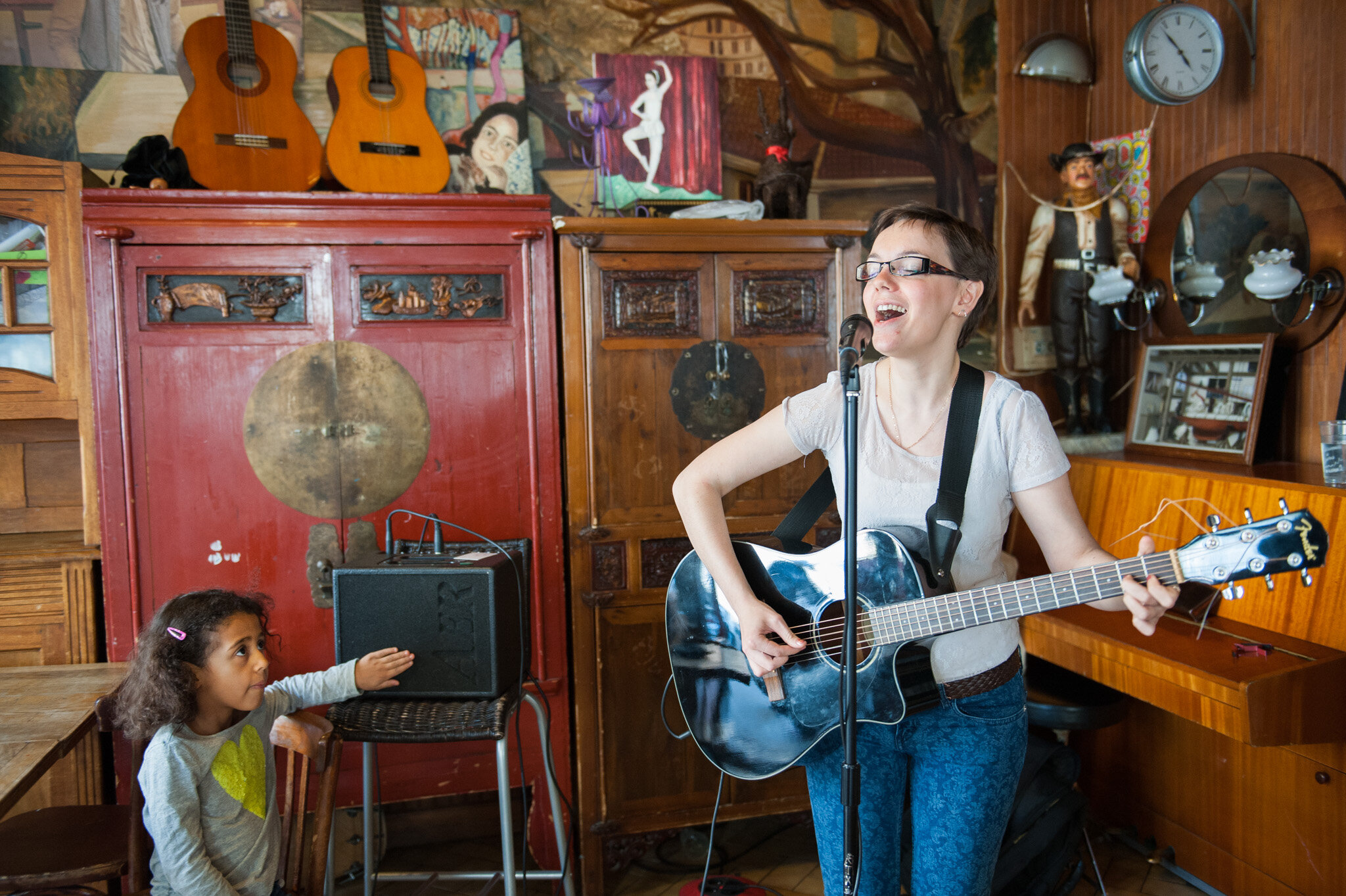    'Canal St. Martin' for National Geographic Traveler    Girl playing the guitar at ‘Chez Adel’ 