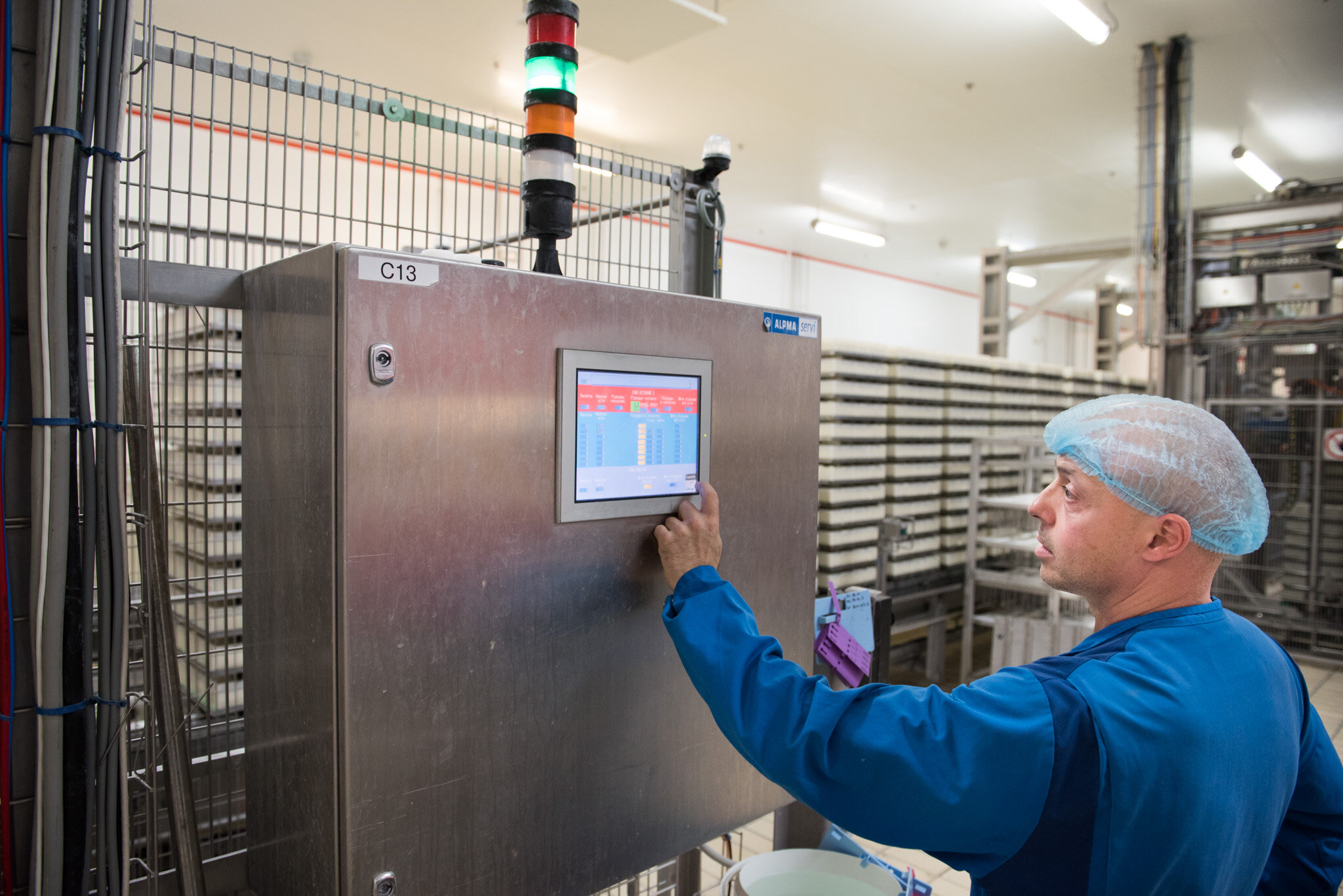    Graindorge cheese for 'Culture' U.S.    Worker checking settings on machine 