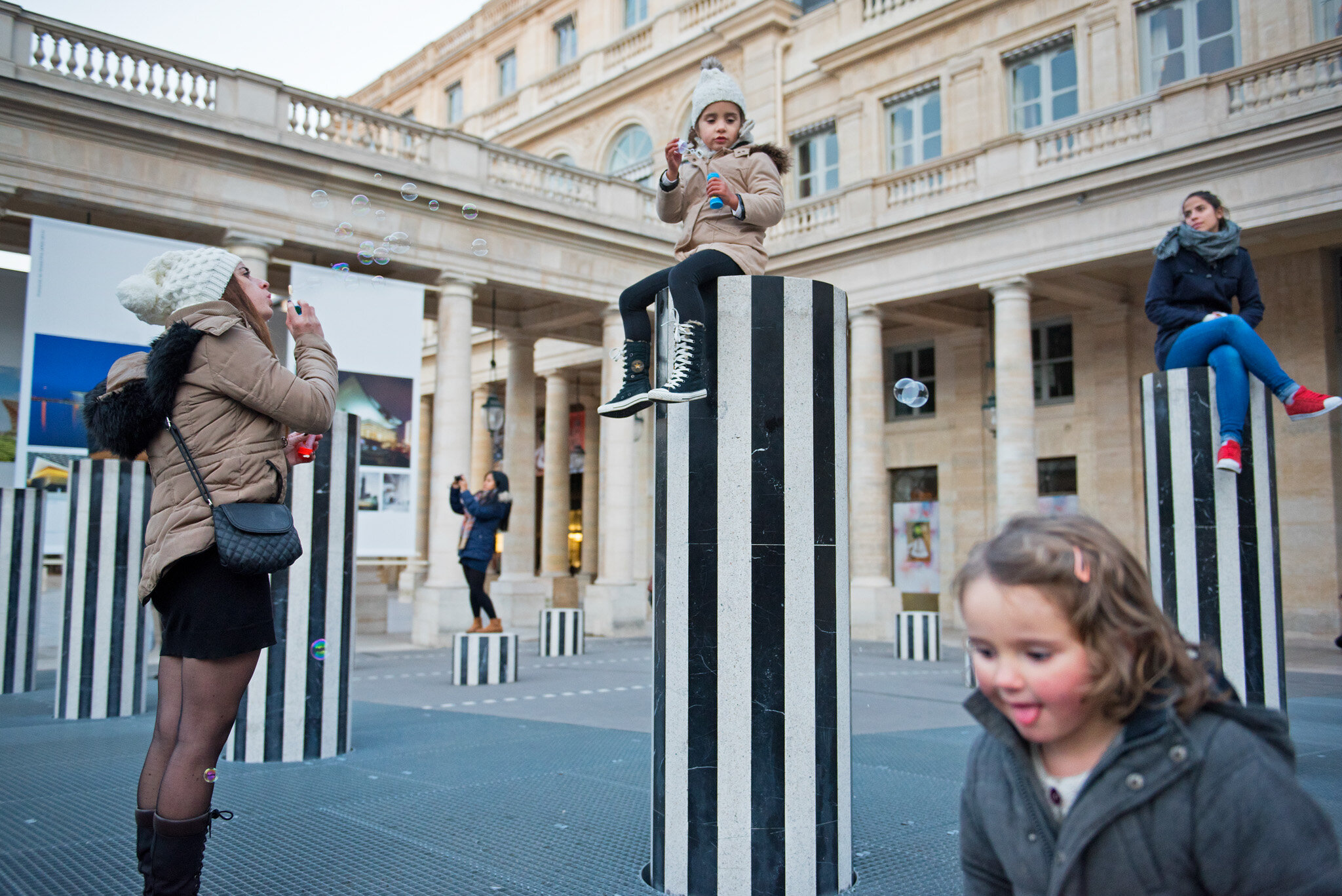    'Paris/NYC' Book 'Edition Lammerhuber'    Kids having fun in Palais Royal. Colonnes de Buren. 
