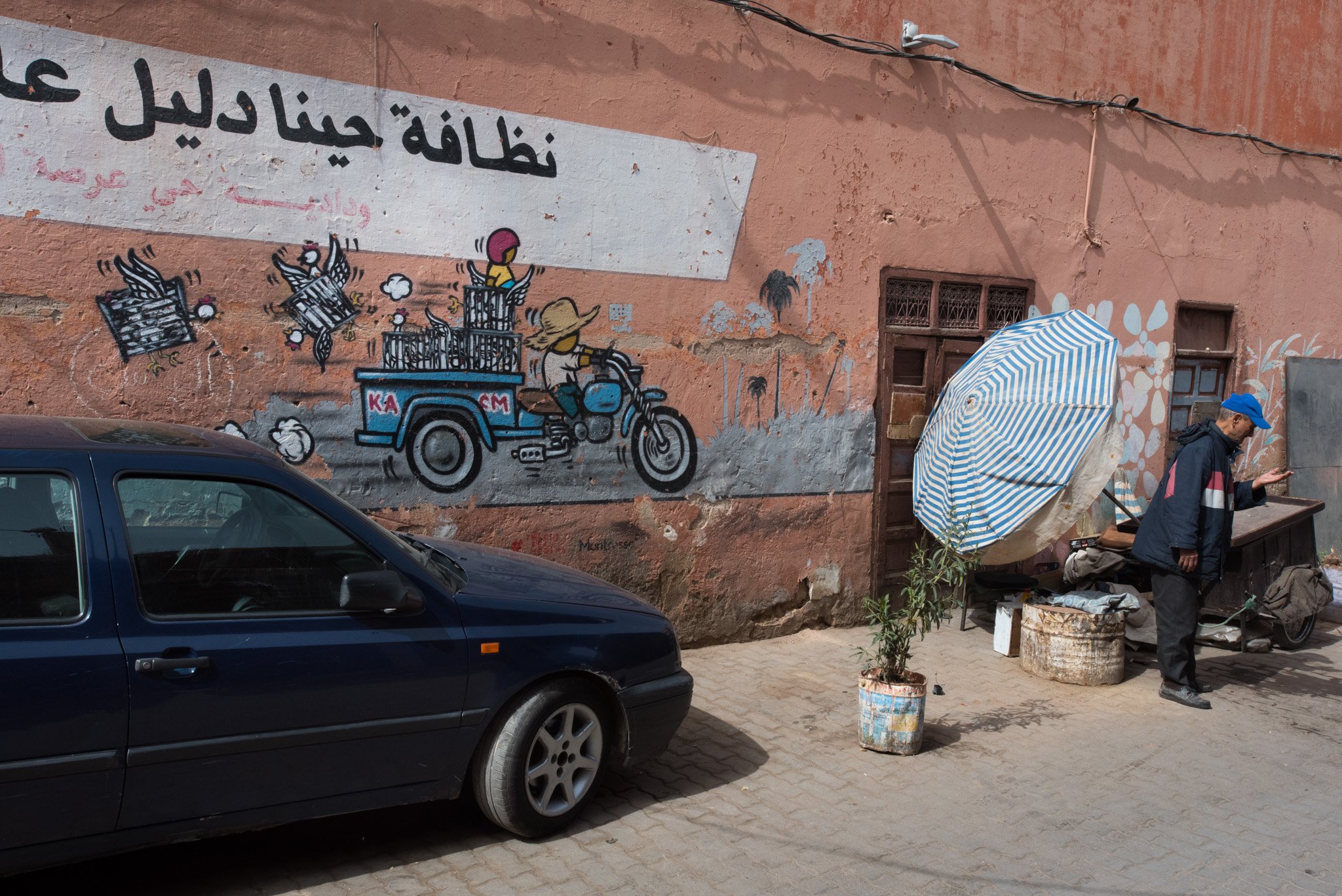    Morocco - Marrakech    Man selling items on the street 