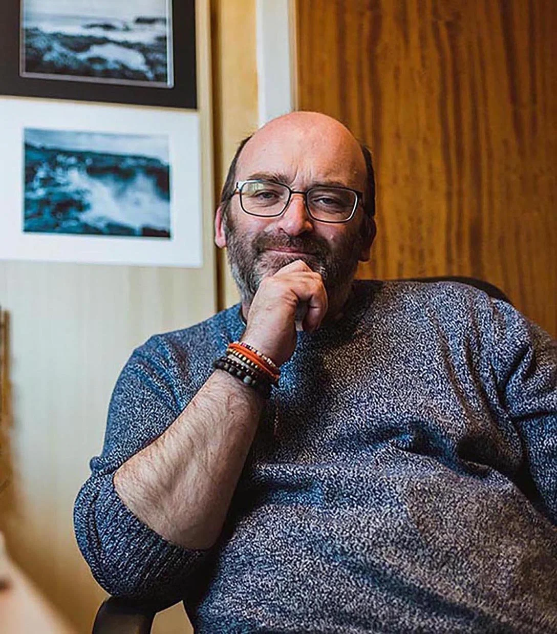 Close-up of Philip with his hand on his chin, looking at the camera.