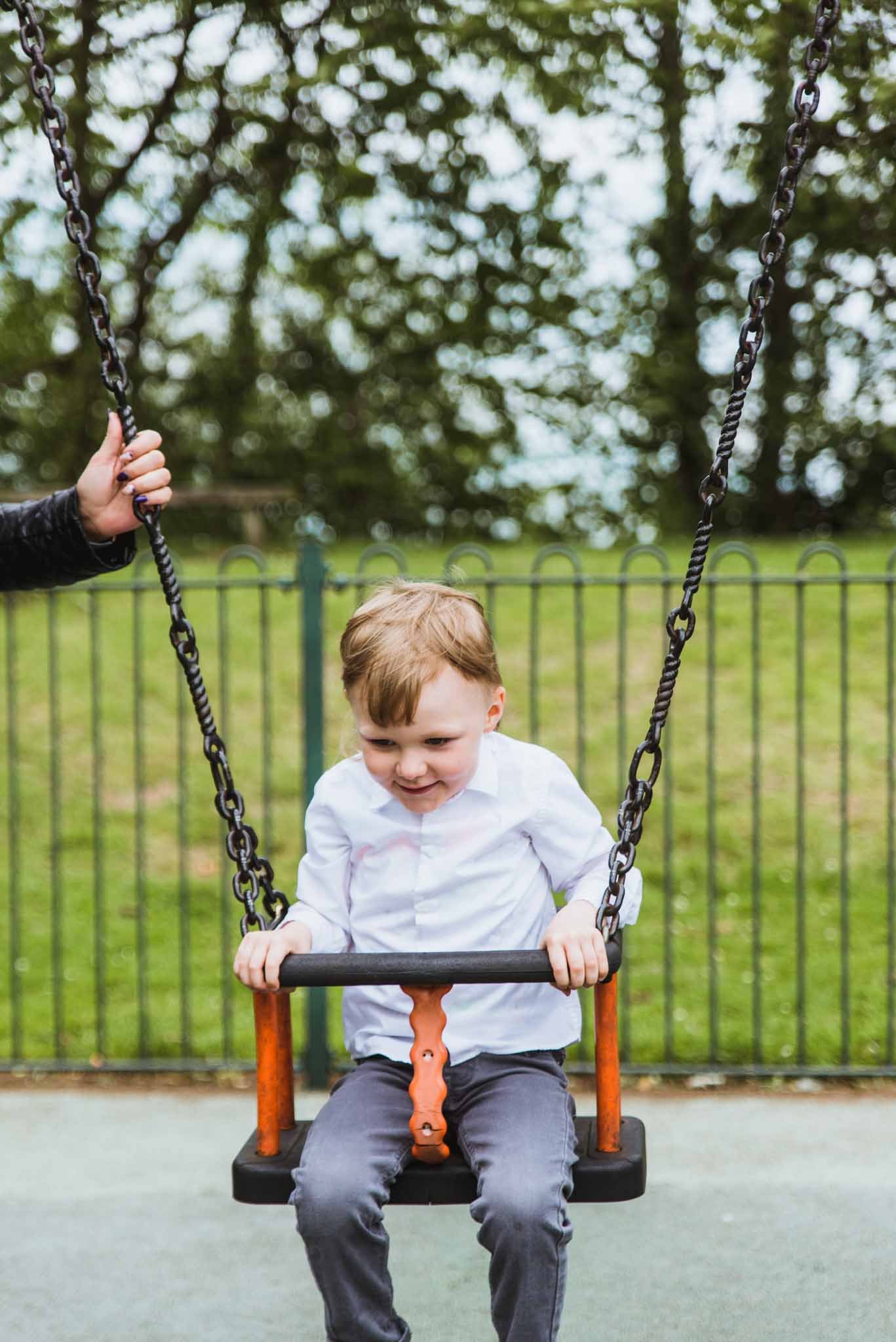 Kid on a swing.
