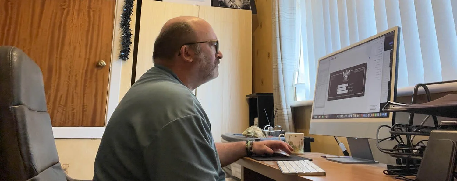 Myself in the office checking artwork and graphic design before emailing.