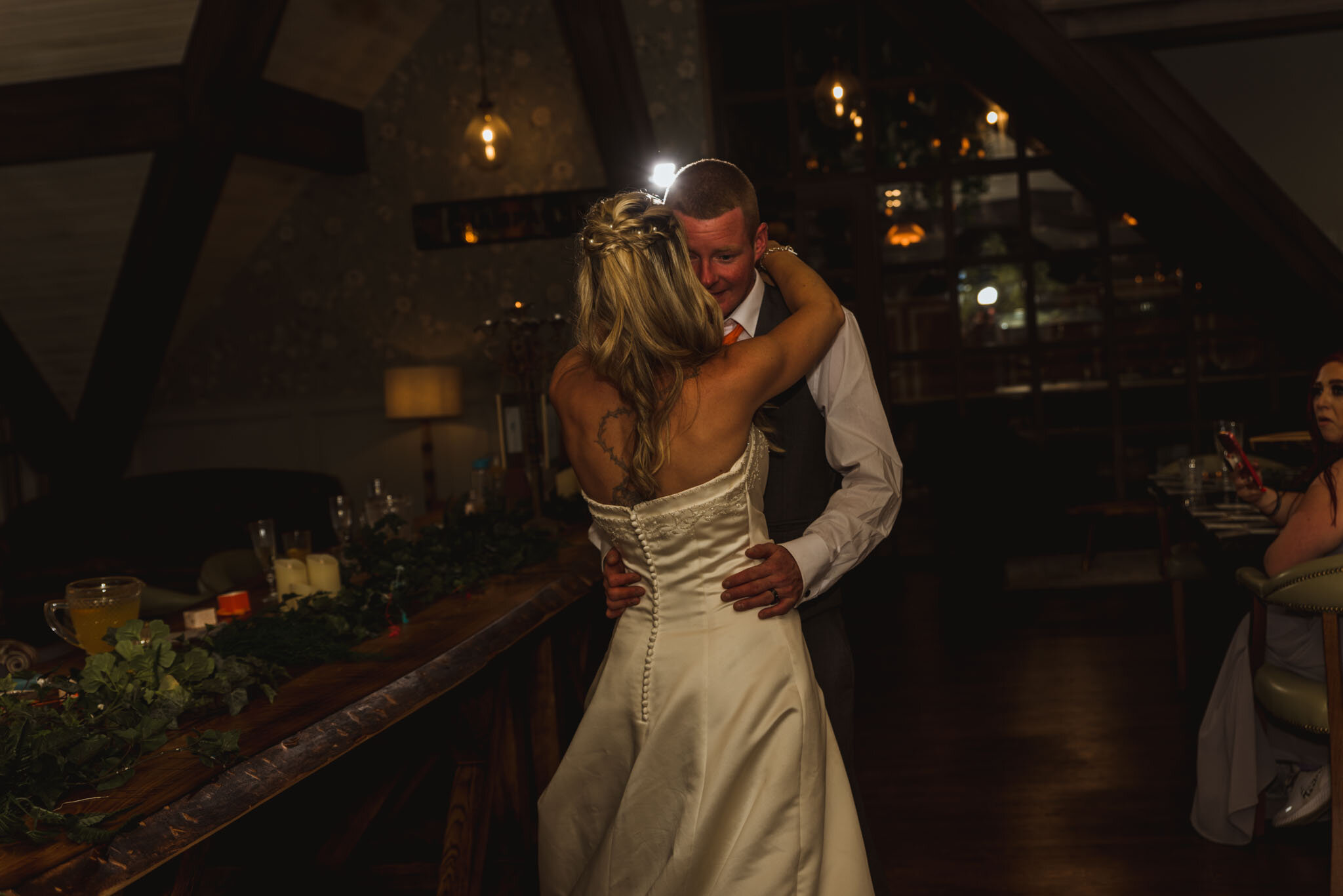  Groom with on bride’s hip for their first dance in The Loft. 
