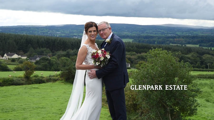  Close up of bride and groom with mountains and trees in distance in County Tyrone. 