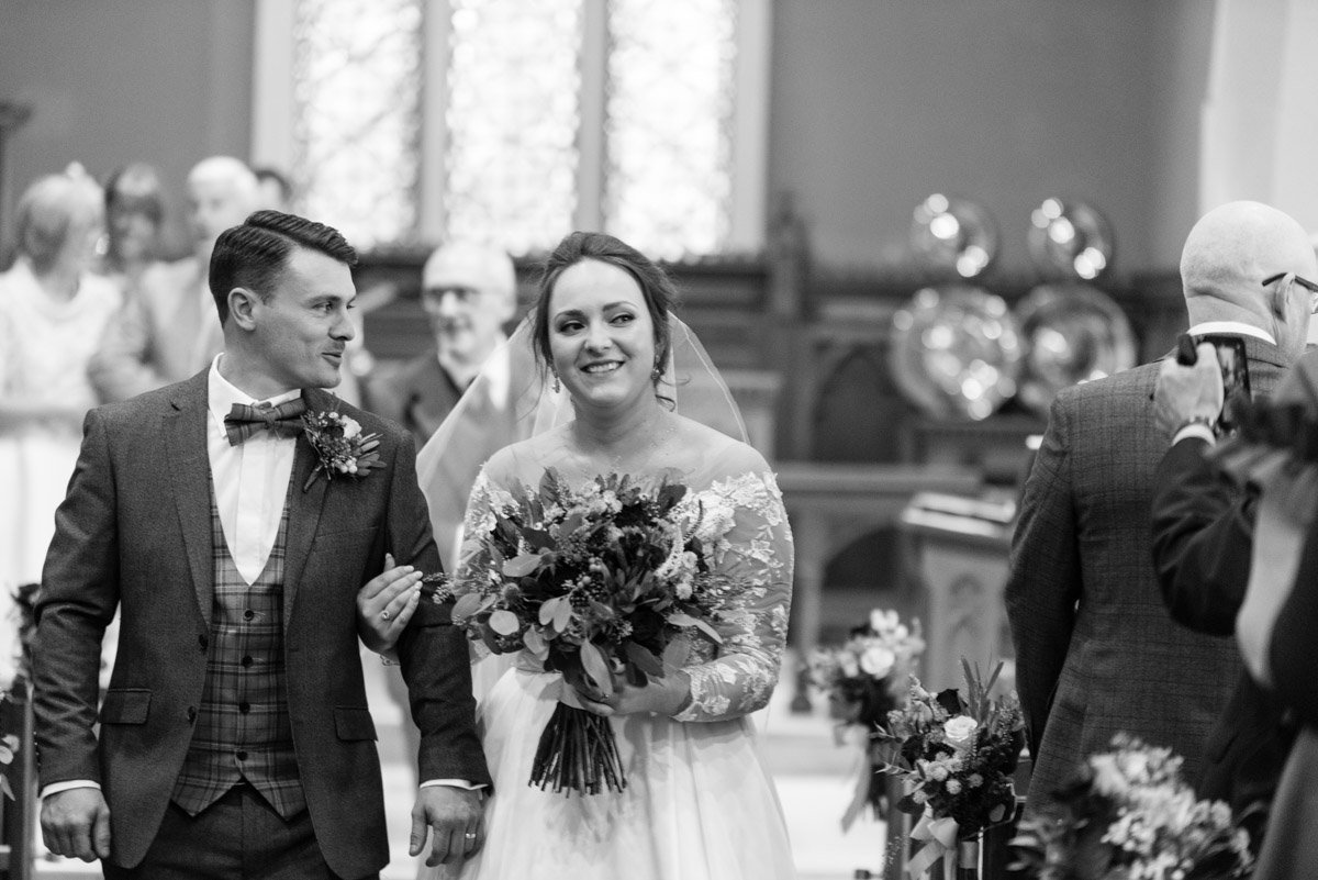  Bride and groom walking down aisle 