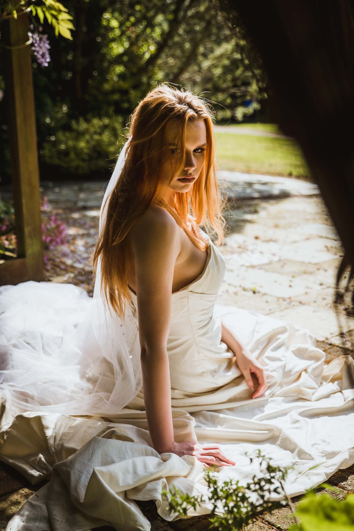  The bride on the ground was photographed from the back with her looking over her shoulder. 