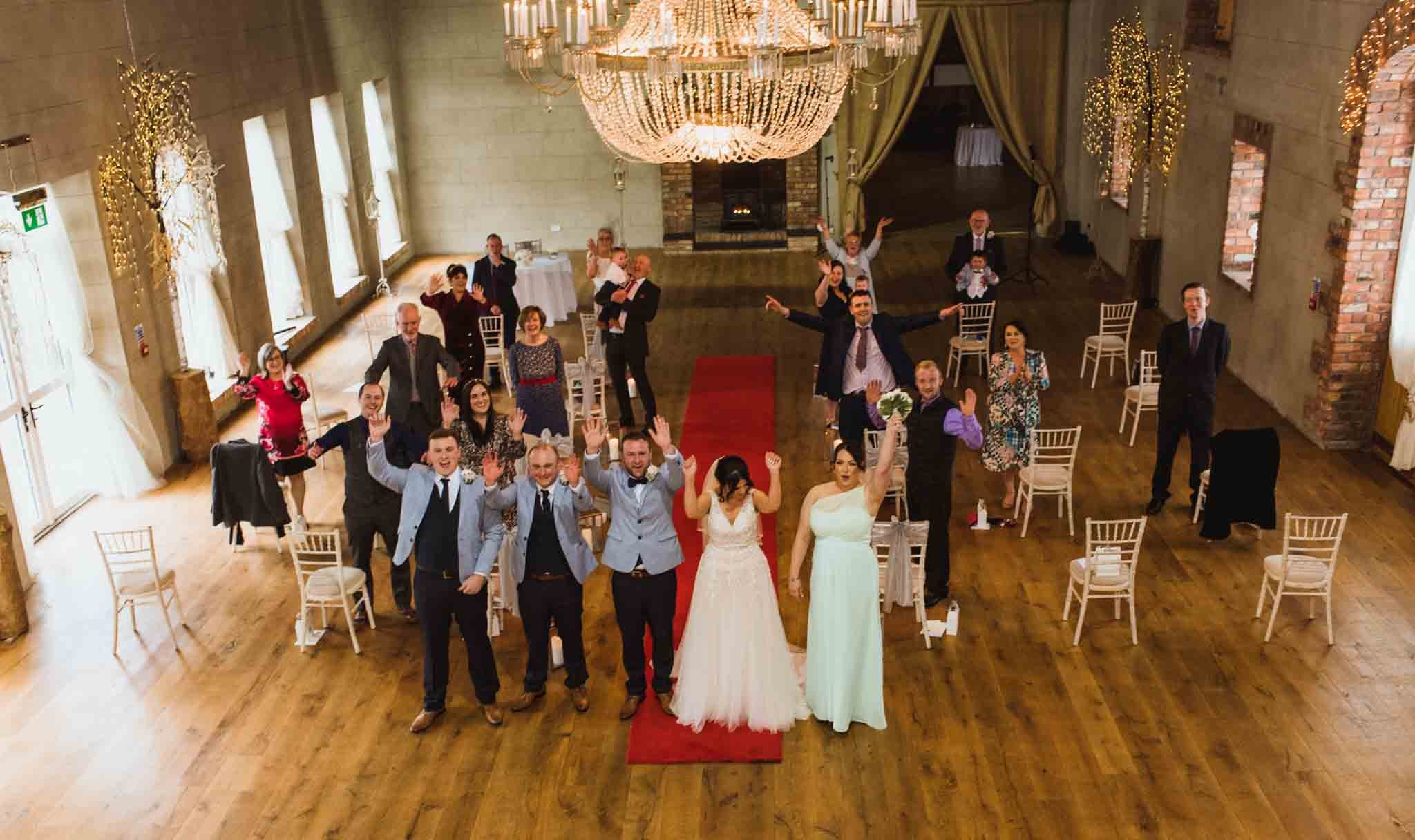  looking down on the wedding venue in Lurgan with bride and groom and all guests cheering. 