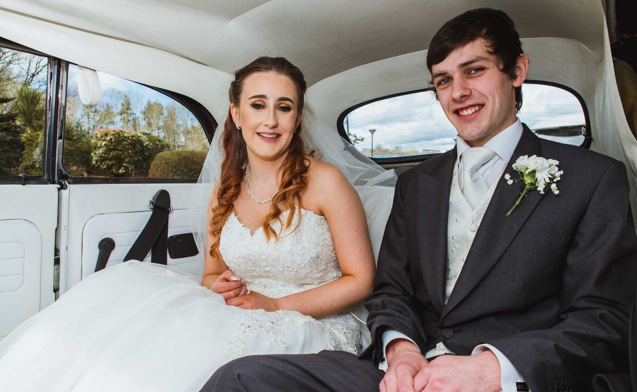  Bride and groom in a car outside the Craigavon wedding venue for their marriage. 