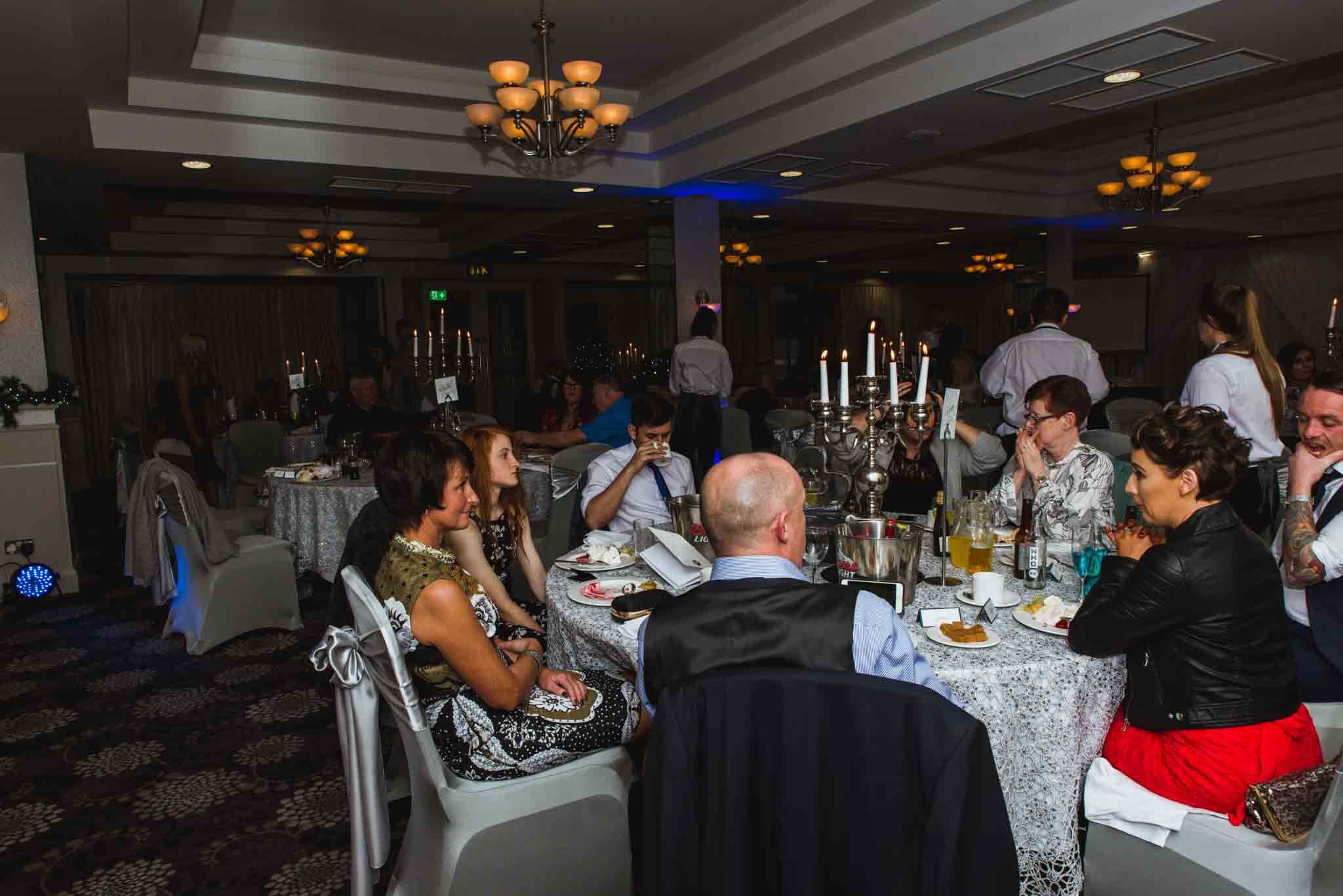 Guests are sitting at tables.