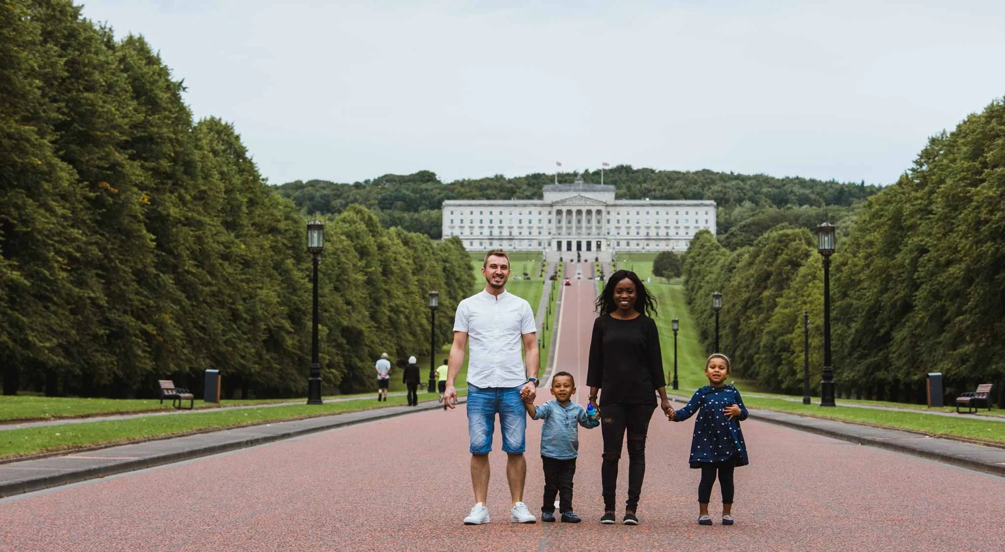 This engaged couple brought their two kids as they stood in front of the parliament buildings.
