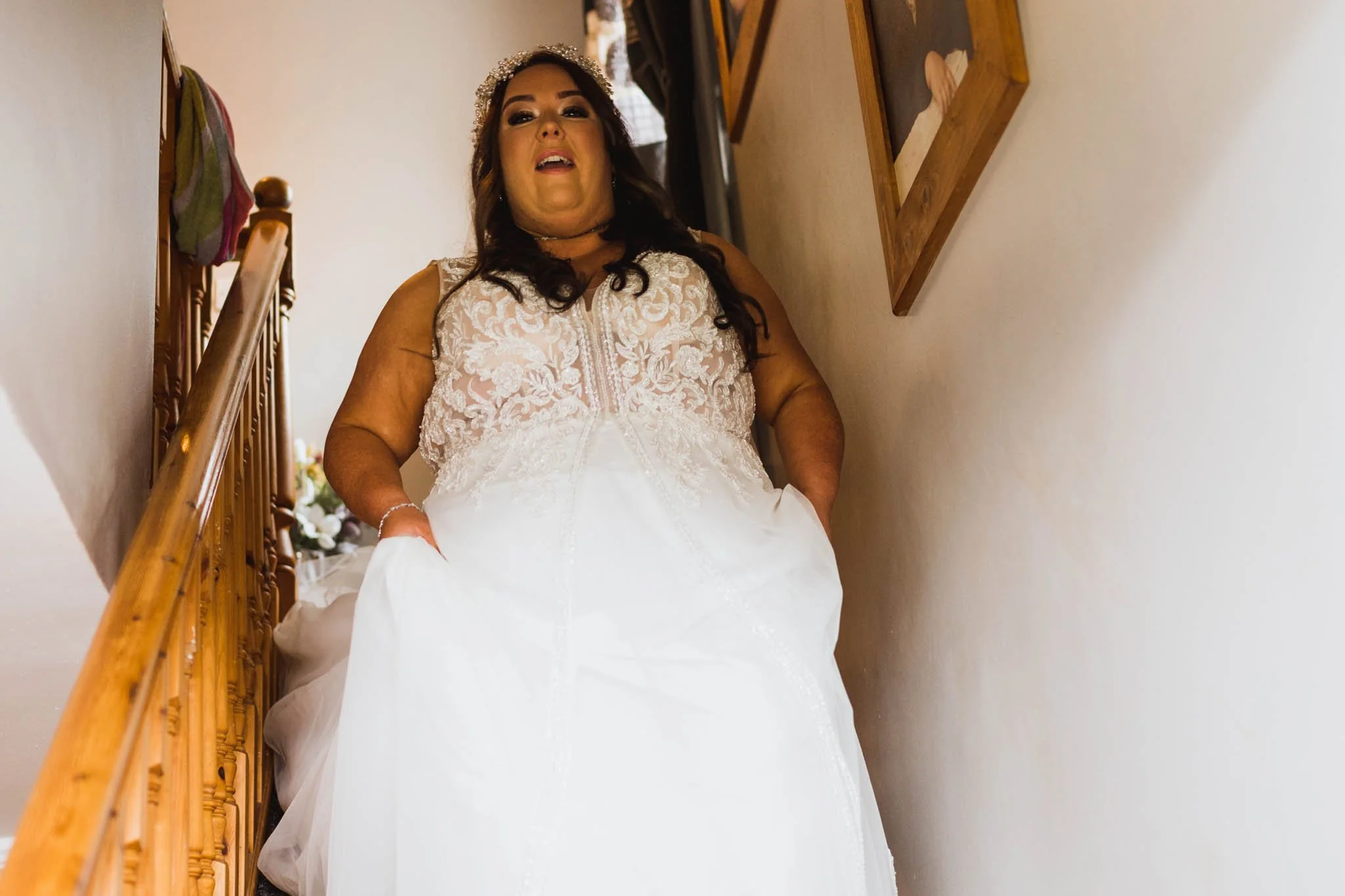 Bride walking down the stairs.