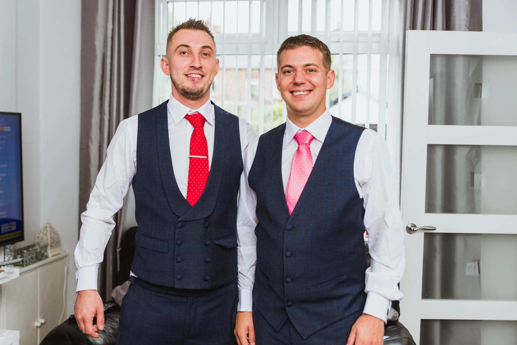Groom and bestman in his parents' living room in Belfast.