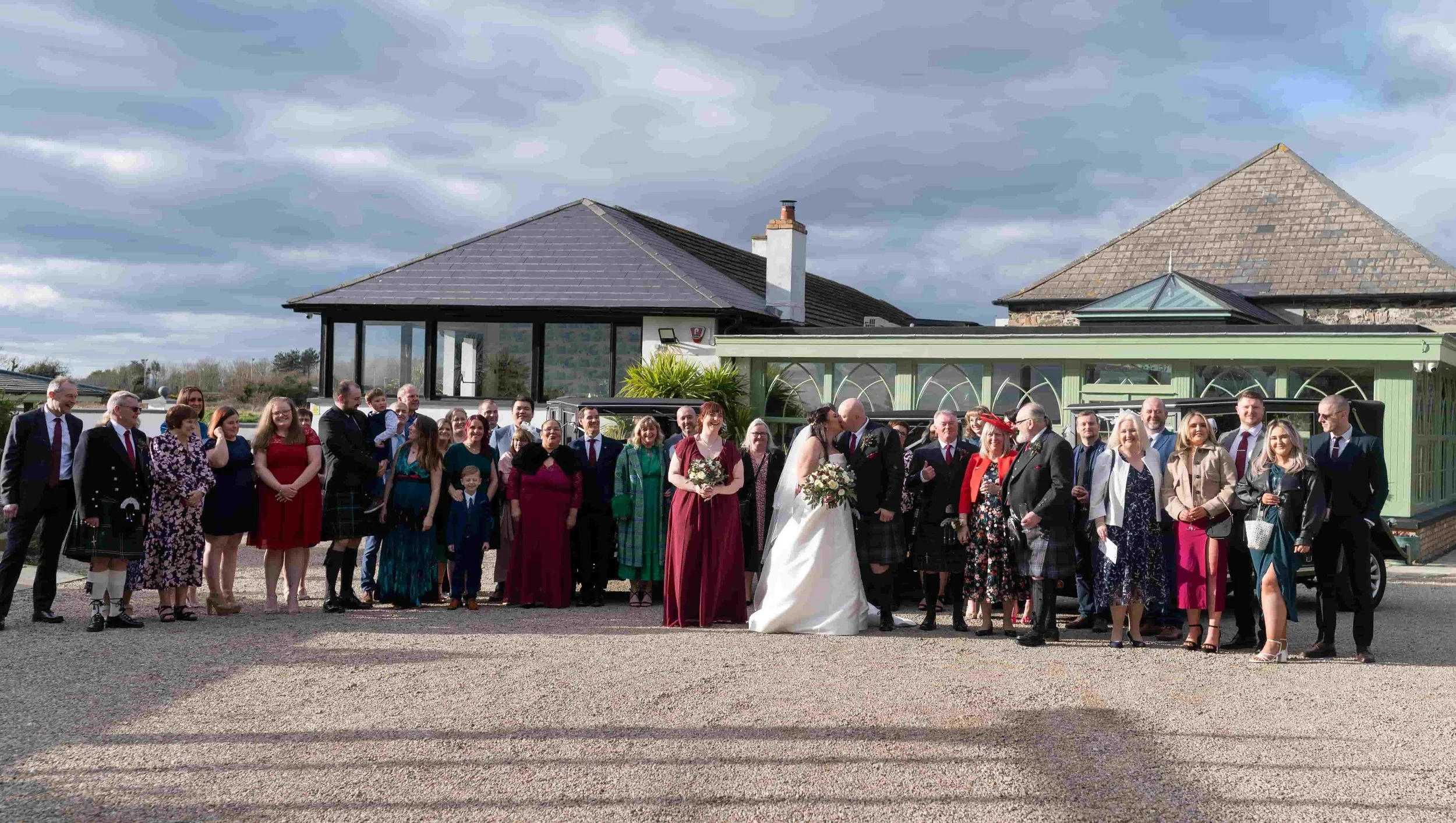 Wedding party outside Orange Tree House.