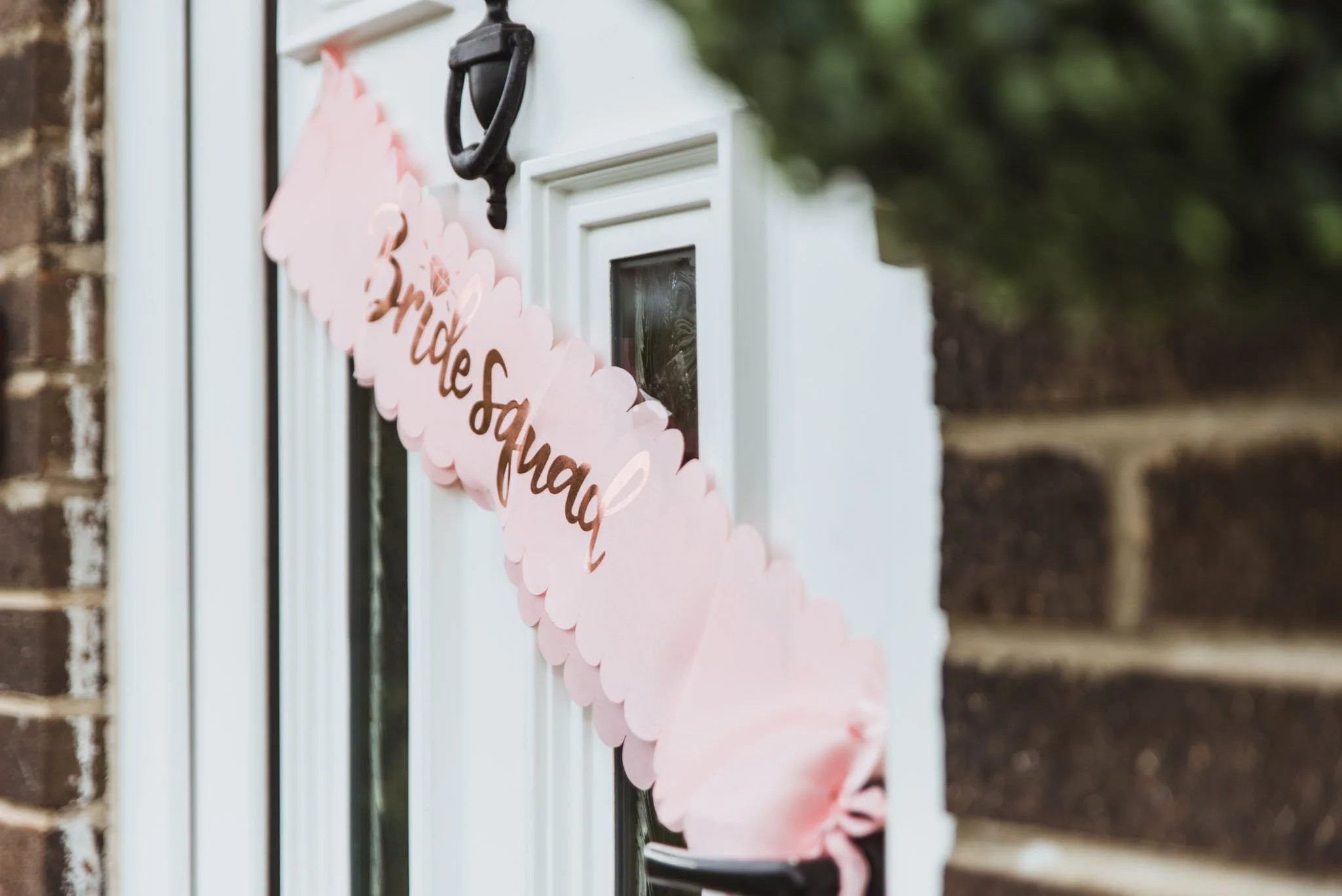 Signage saying bride squad on the door in Killicomaine.