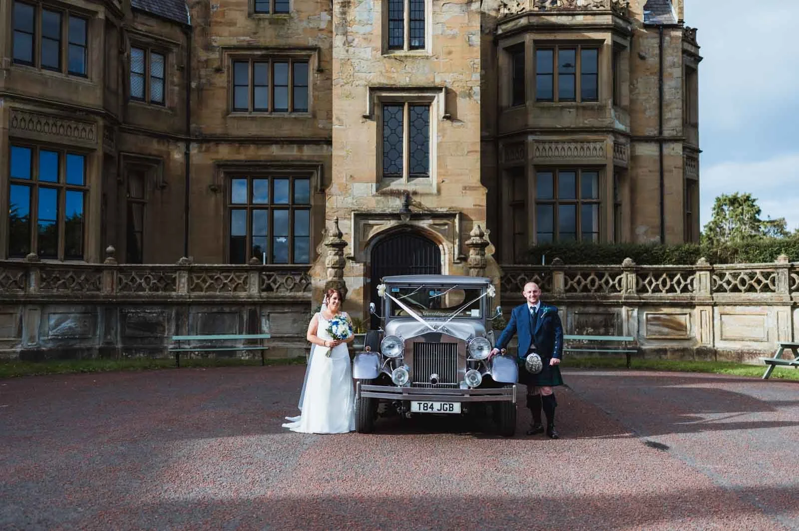 The bride and groom beside the car navigated the website.
