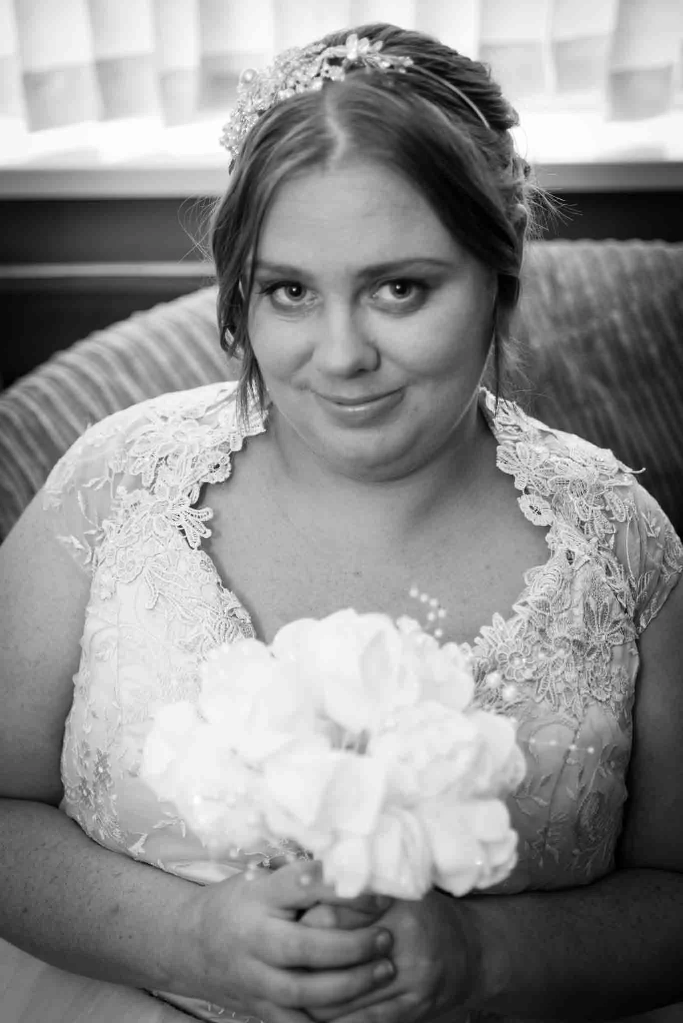 Mono image of the bride with the bouquet at her house on the Armagh Road.
