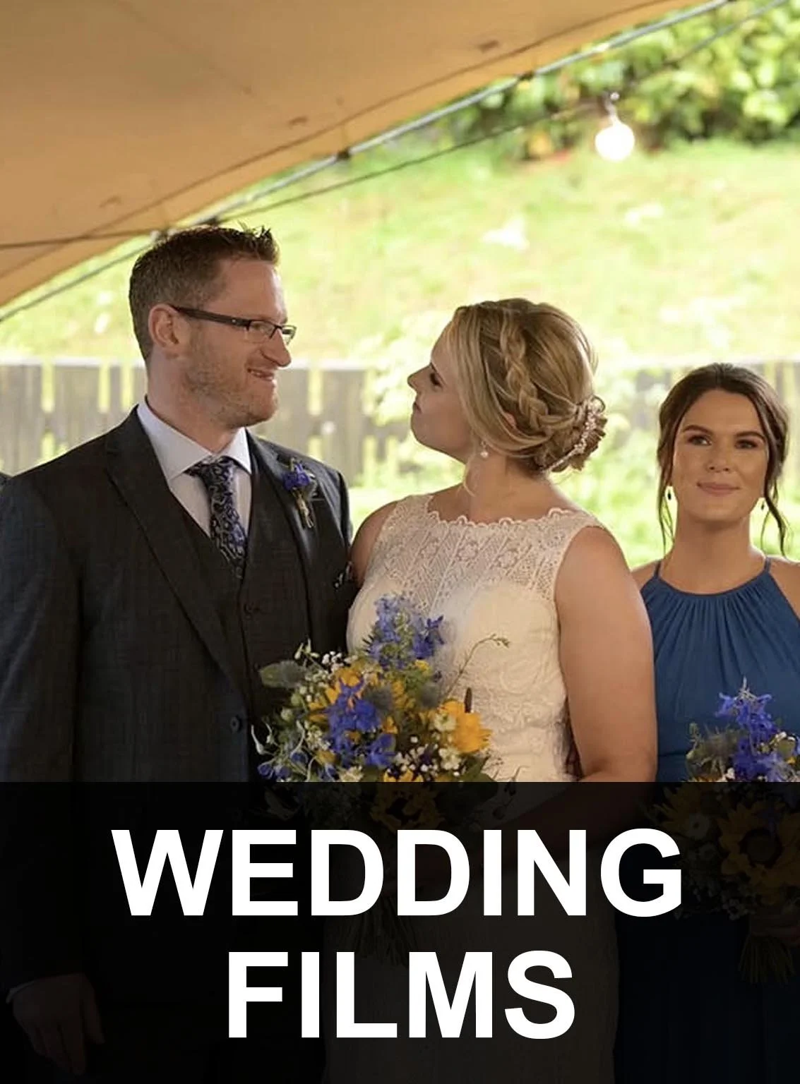 The bride looks into the groom's eyes in love with the maid of honour behind them.