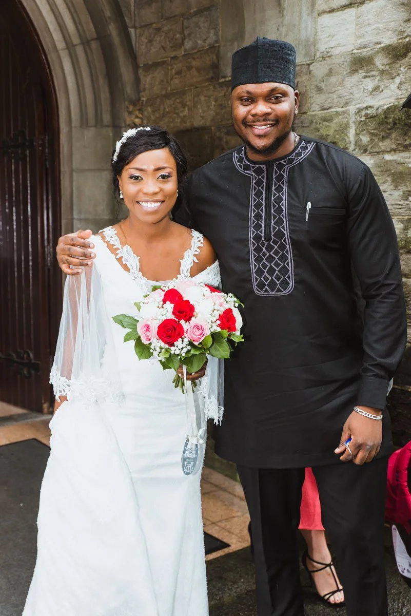 Bride standing beside a South African relative outside the church.