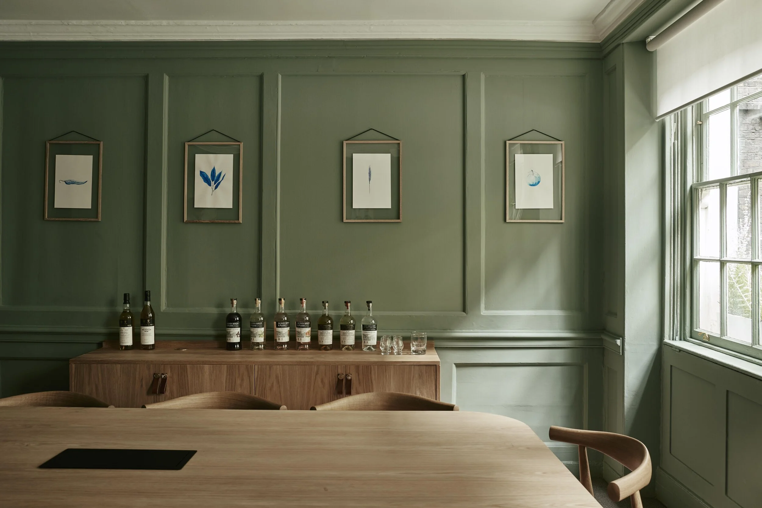 Sage green accents, marble and natural wood meet bright spaces and organic designs
