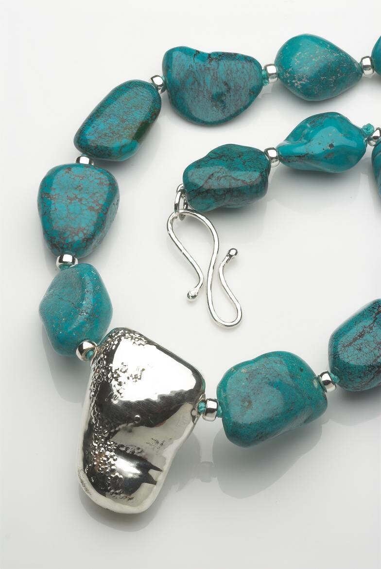 Necklace of Turquoise smooth rocks with hallmarked silver shape. £740.jpg