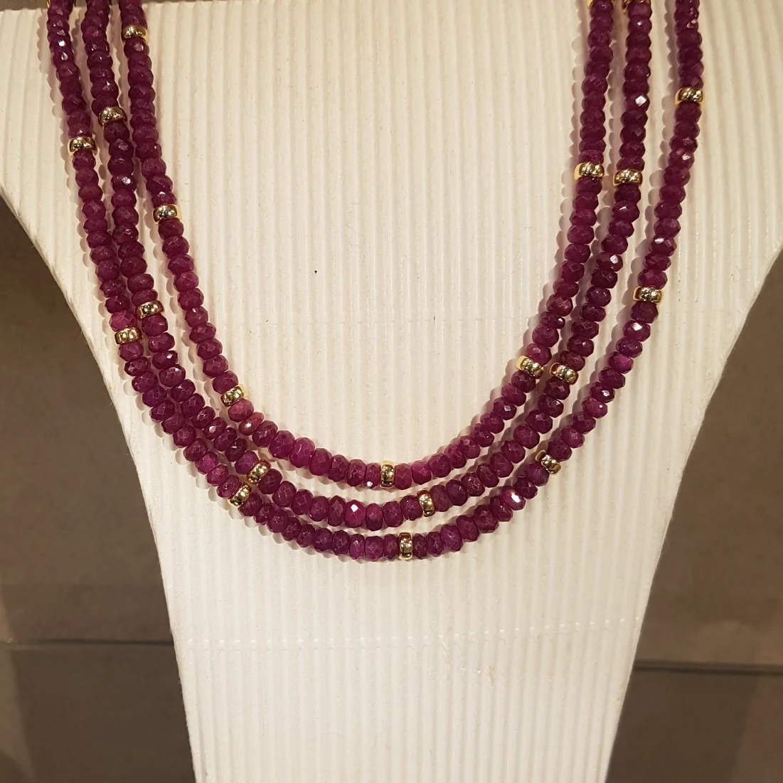 Fine Emeralds or Rubies with 18ct Gold Beads and clasp.