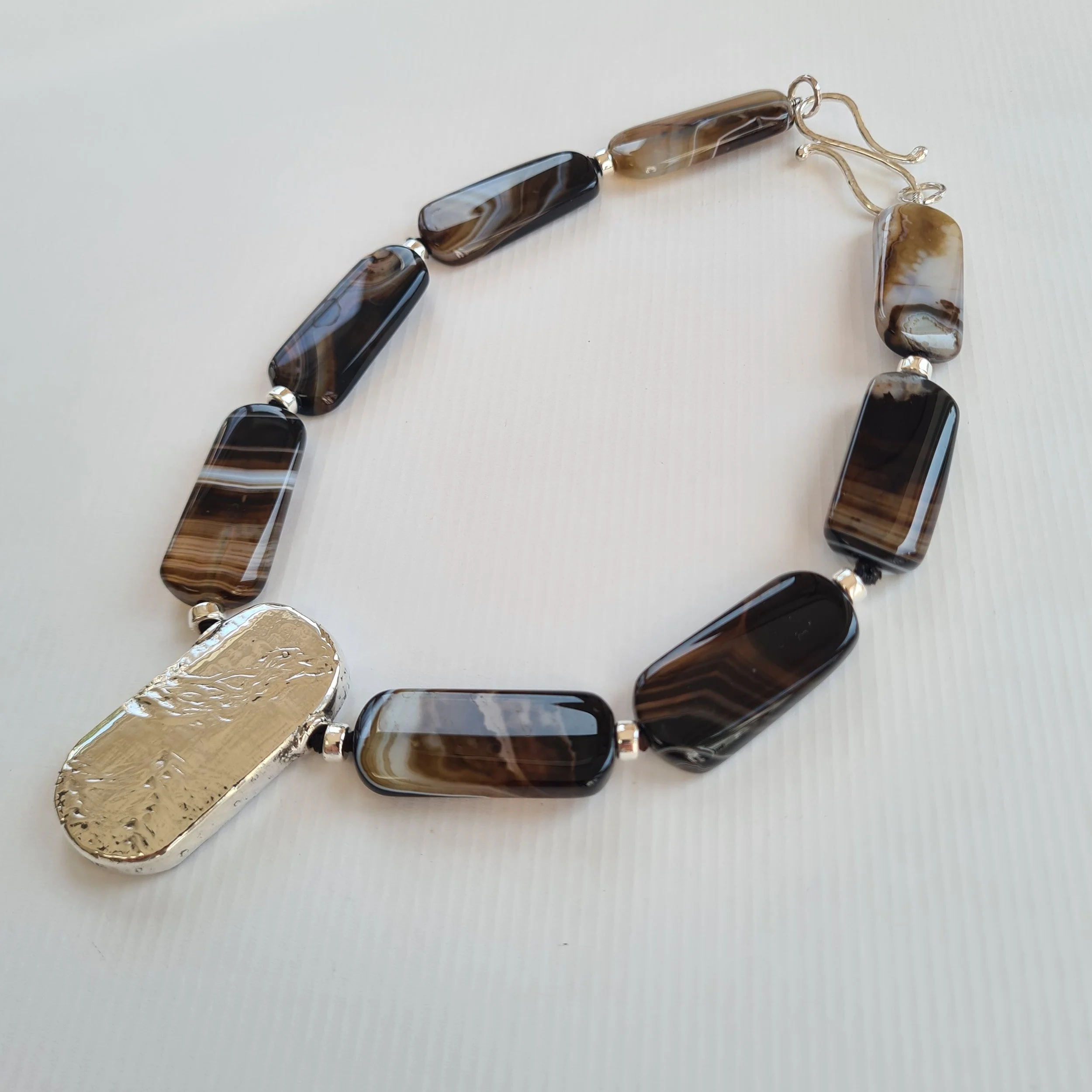 Oblong Banded Agates With Central Silver Shape