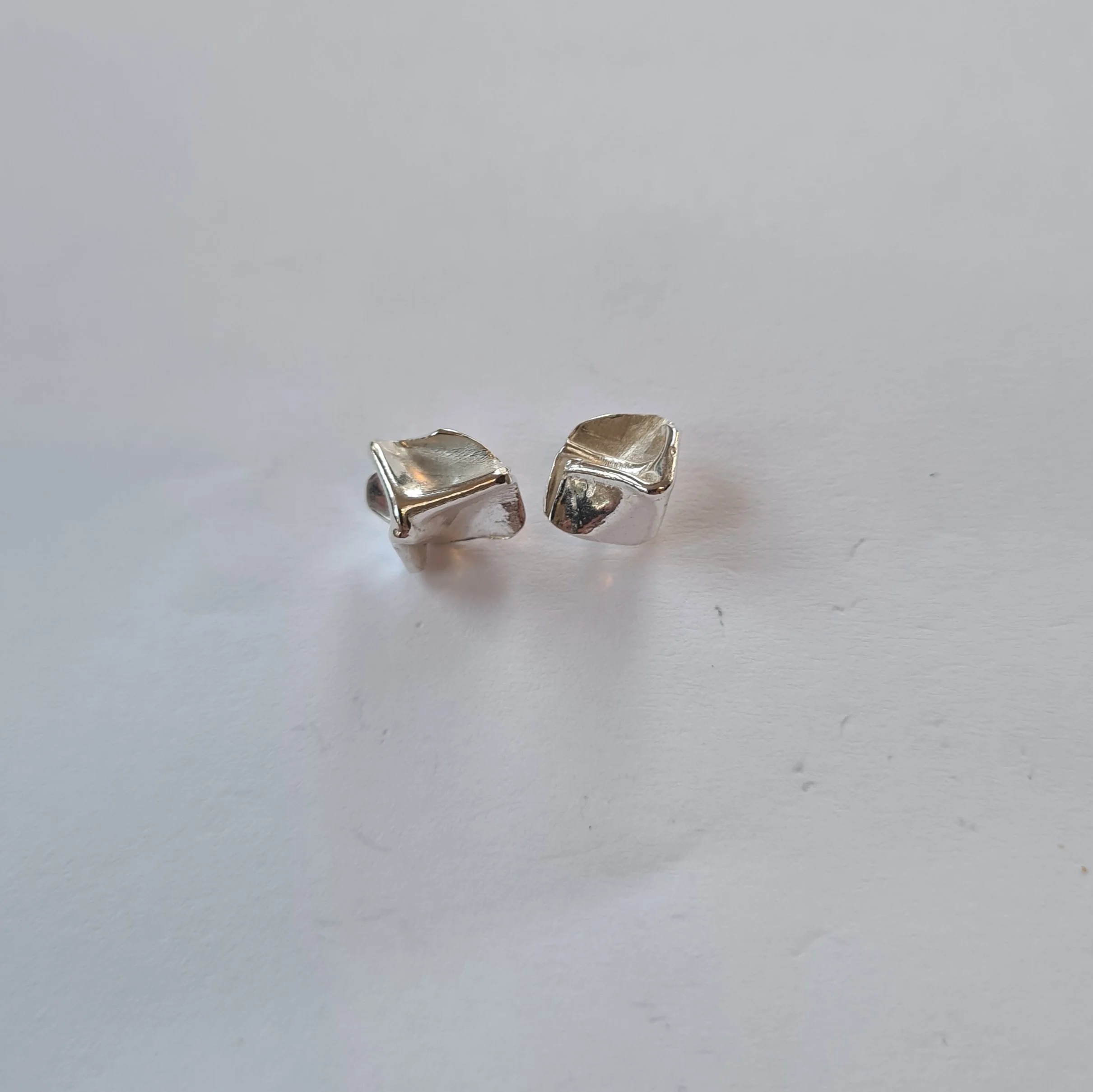 A. Tiny Crumpled Silver Earrings