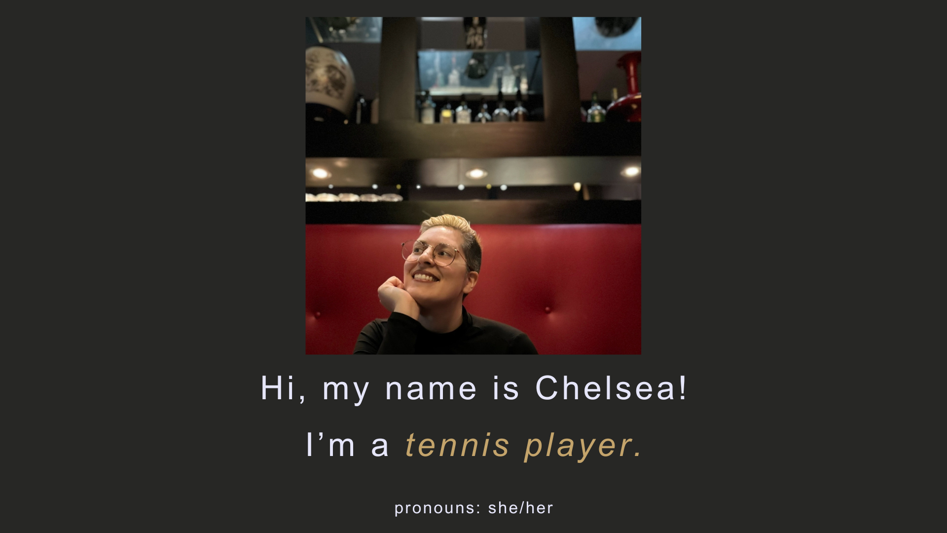 A smiling person named Chelsea is sitting in a restaurant booth with a red cushioned wall behind them. They are wearing glasses and a black top. The overlay on the image introduces Chelsea, a tennis player, and mentions pronouns: she/her.