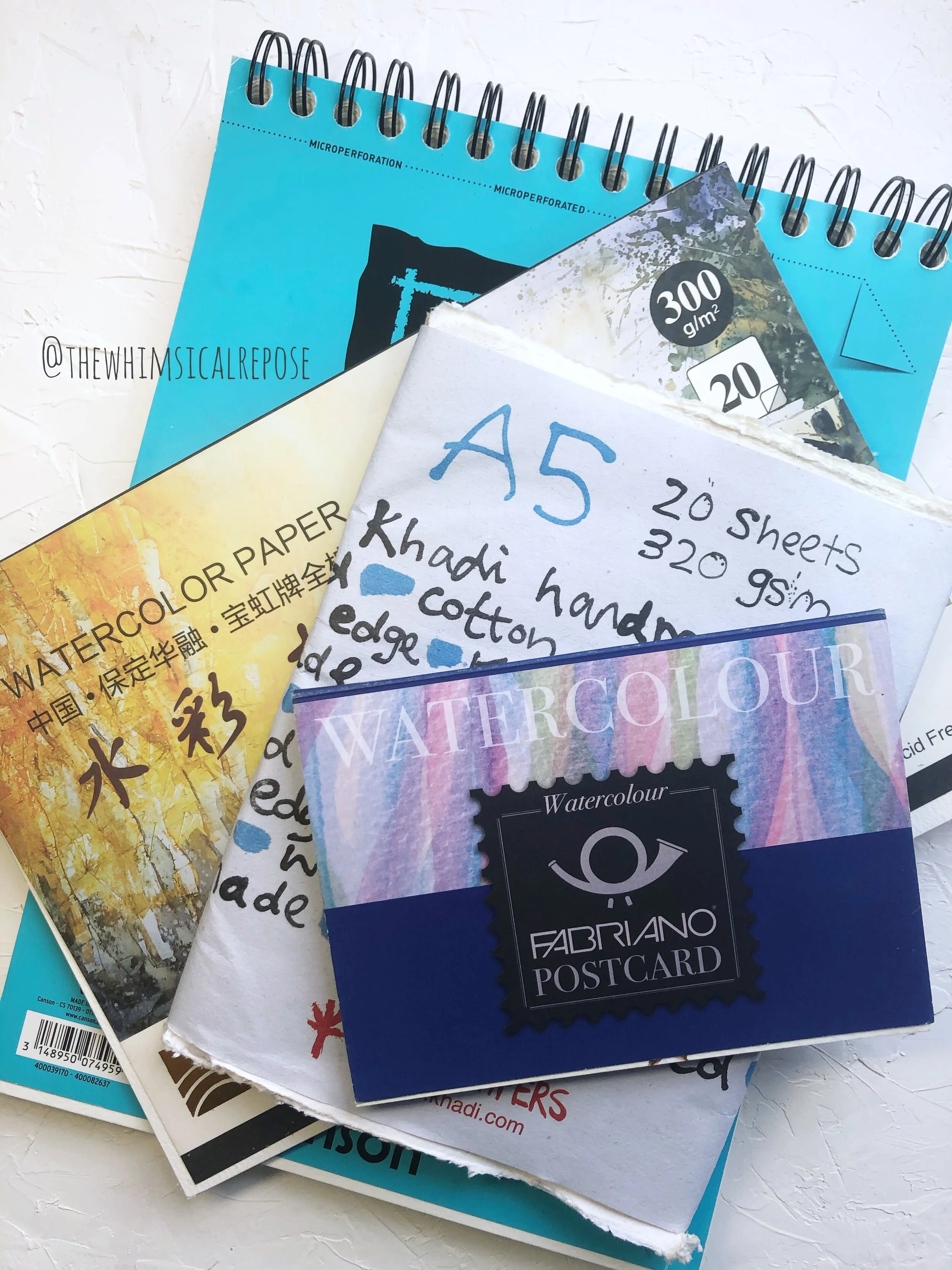 These are just some of the brands of paper I’m using and I encourage you to go and try as many types of paper as possible. What may work for some artists may not work for you. For example, I know some artists love using the Canson 100% cotton paper but some artists avoid it at all costs, so at the end of the day, after weighing all the pros and cons, it still comes down to personal preference. That’s why it is important to do your research and then try out the papers that interest you, this is how you find YOUR paper, the one that works for you and your paintings.