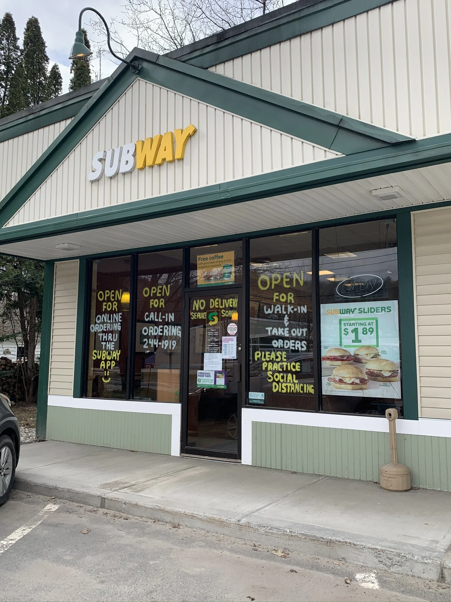   Many delis and restaurants are open for pickup. Subway explains the new rules on its storefront on South Main Street. Photo by Lisa Scagliotti.  