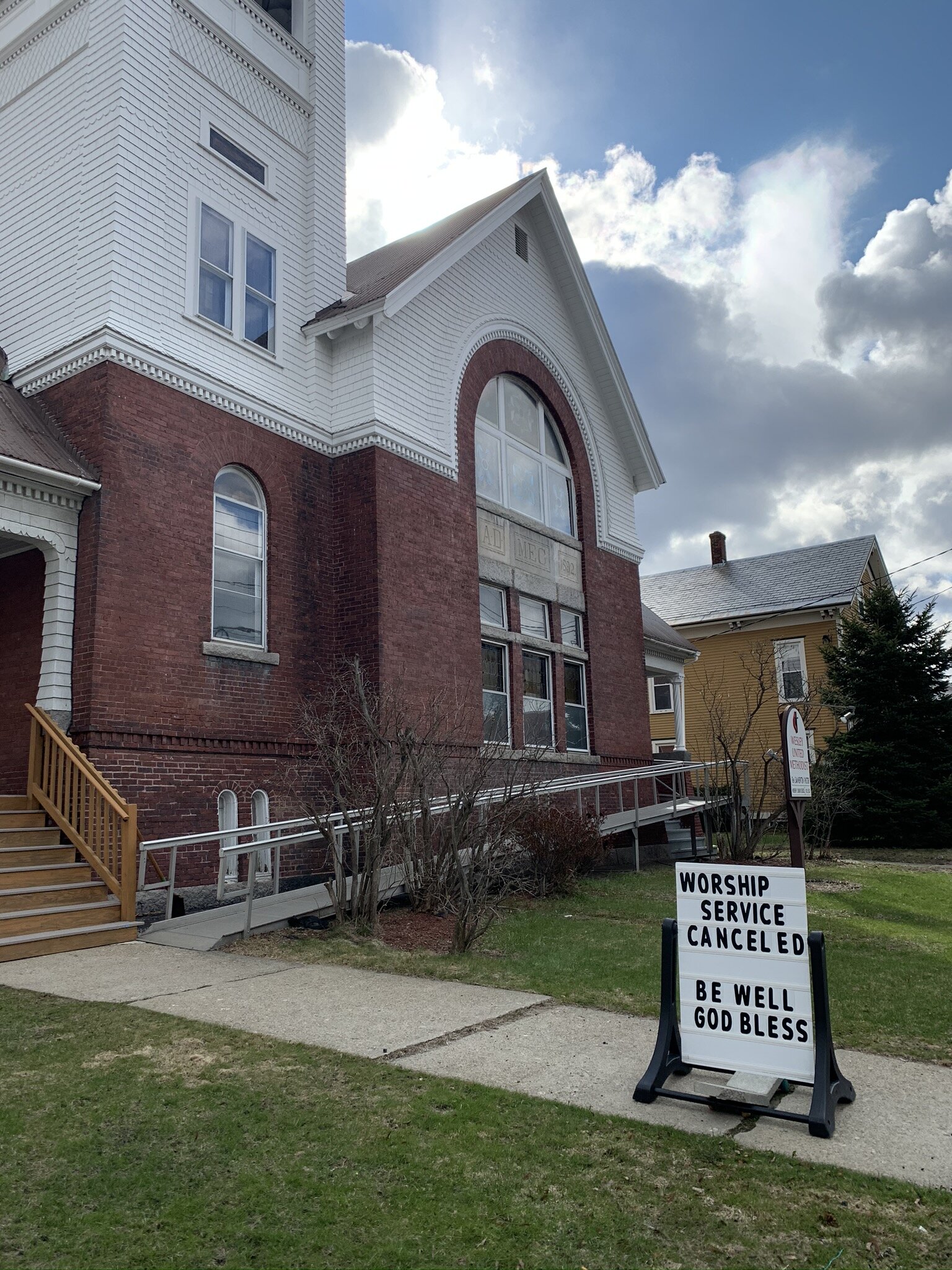   The Wesleyan United Methodist Church gets a three-fold message out on its sidewalk sign on South Main Street. Photo by Lisa Scagliotti.  