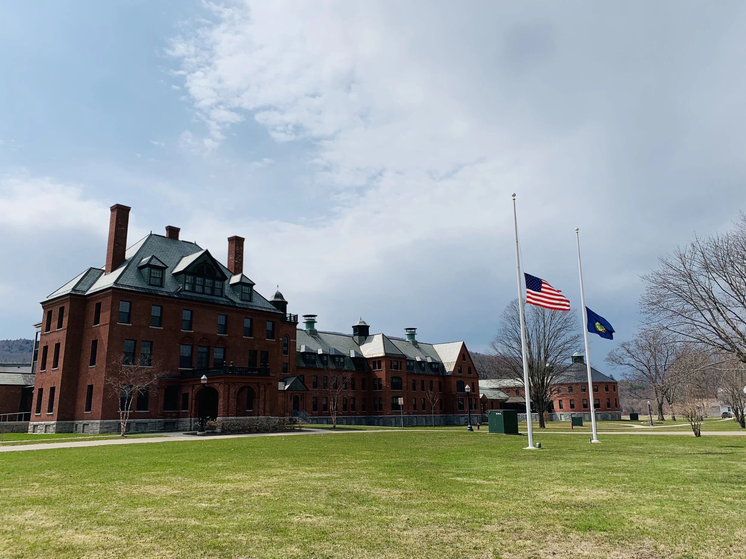   To honor those who have died from COVID-19, flags fly at half mast at the State Office Complex in downtown Waterbury April 19. Photo by Lisa Scagliotti.  