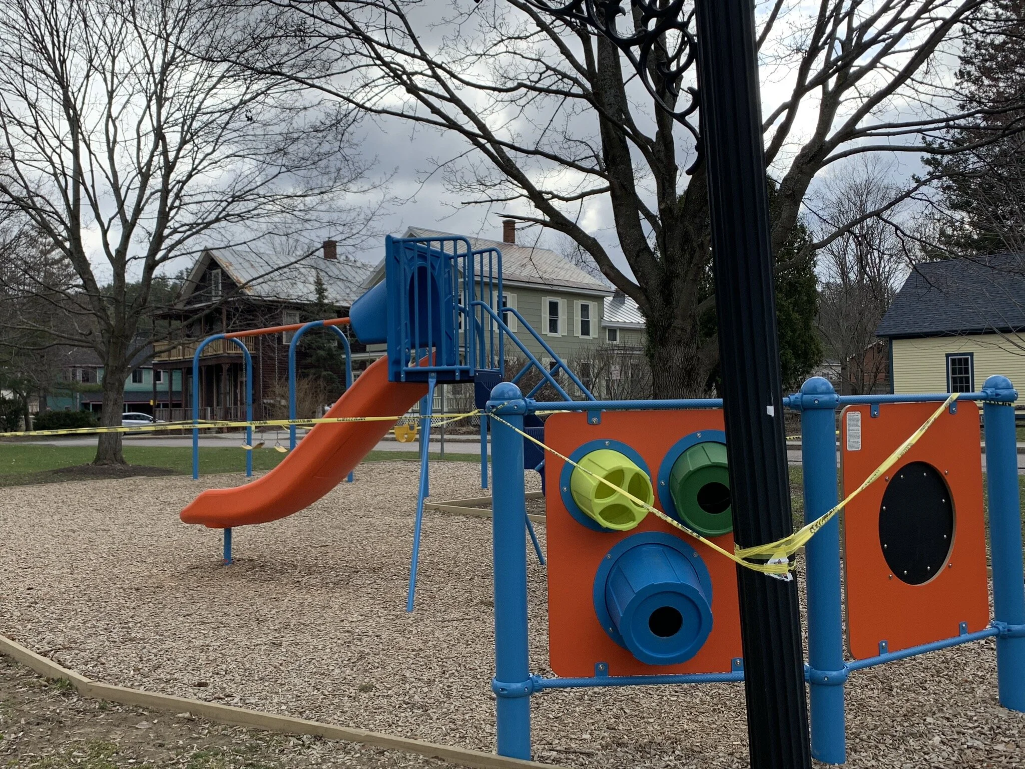   Park equipment like the play structure and swings at Rusty Parker Park is off-limits as local officials discourage residents from spending time in parks. Walking through parks to get exercise and fresh air is encouraged but residents are asked to r