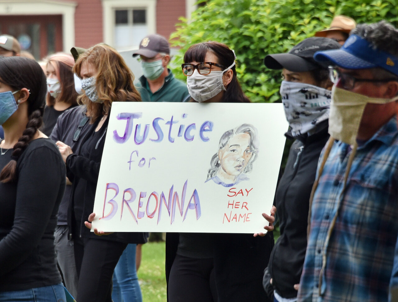 Many called attention to black Americans who have died at the hands of police. Photo by Gordon Miller.