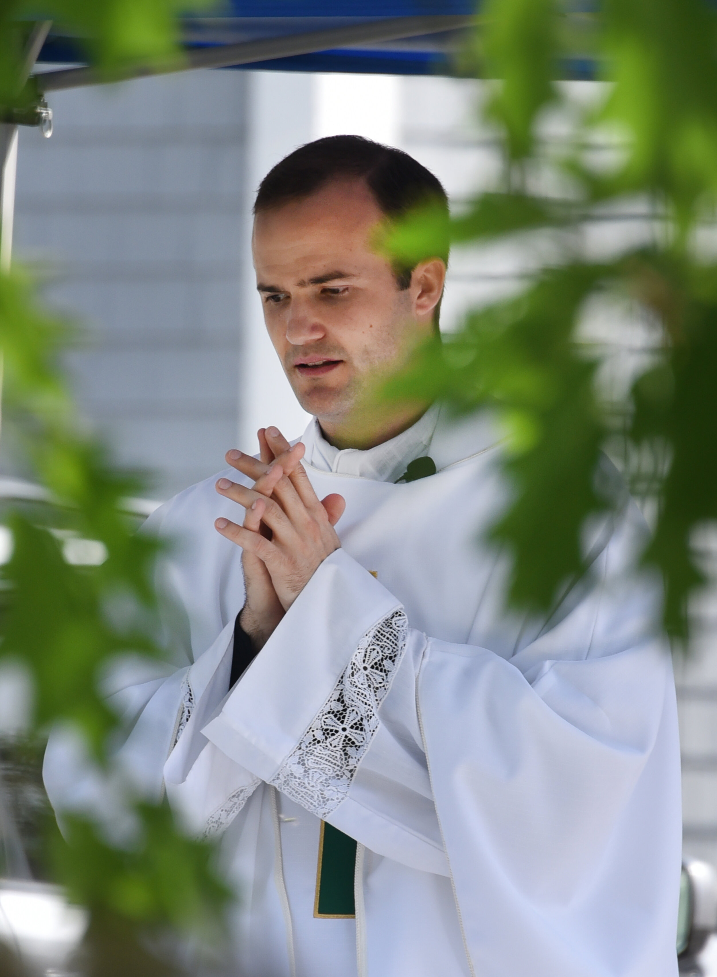   Fr. Matthew Rensch, new pastor at St. Andrew's officiated the mass. Photo by Gordon Miller.  