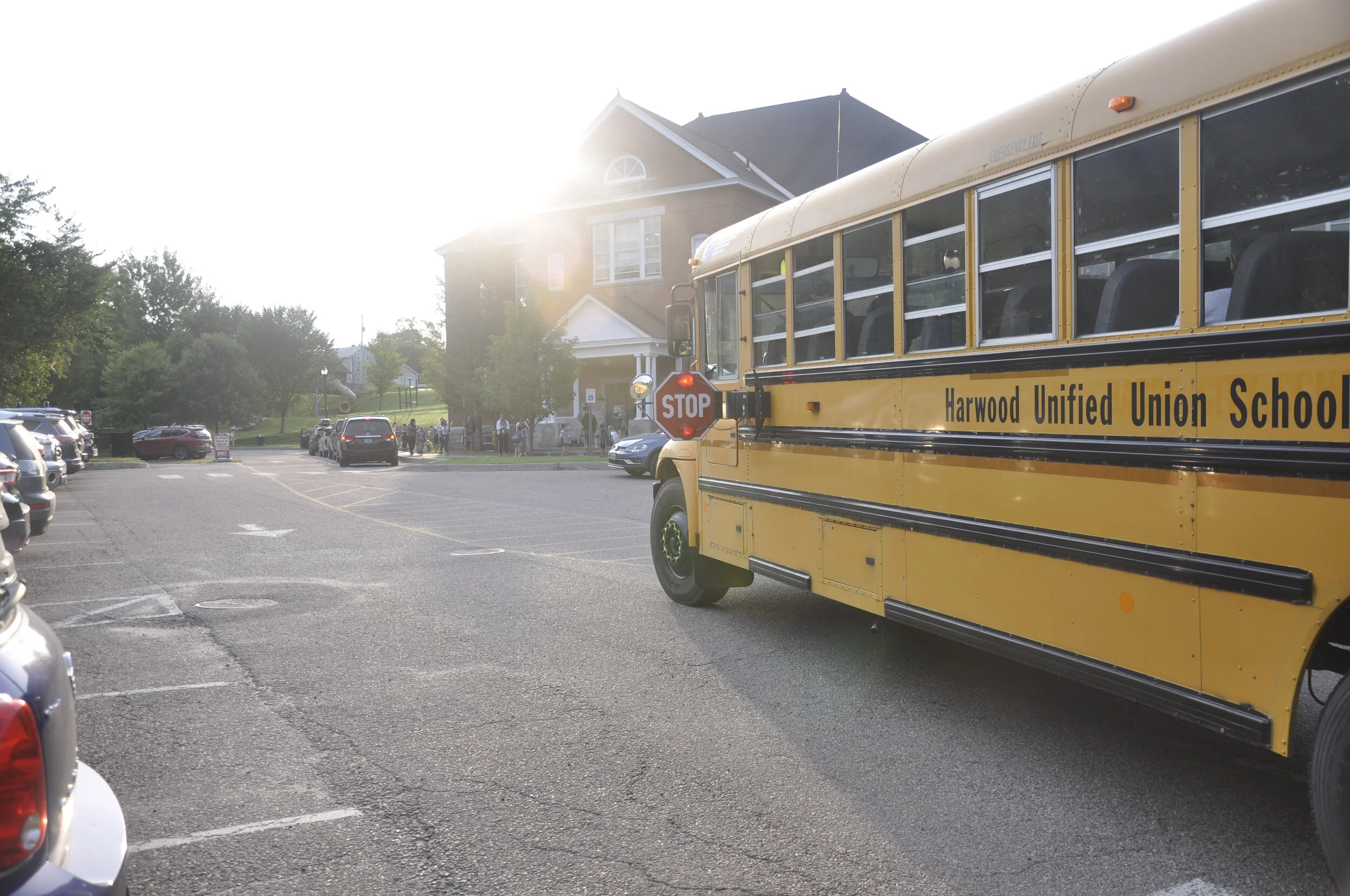   Buses with many empty seats rolled into the Thatcher Brook lot to drop off students. Only half the school's students attended Tuesday and many opted to arrive by car or on foot. Photo by Lisa Scagliotti.  