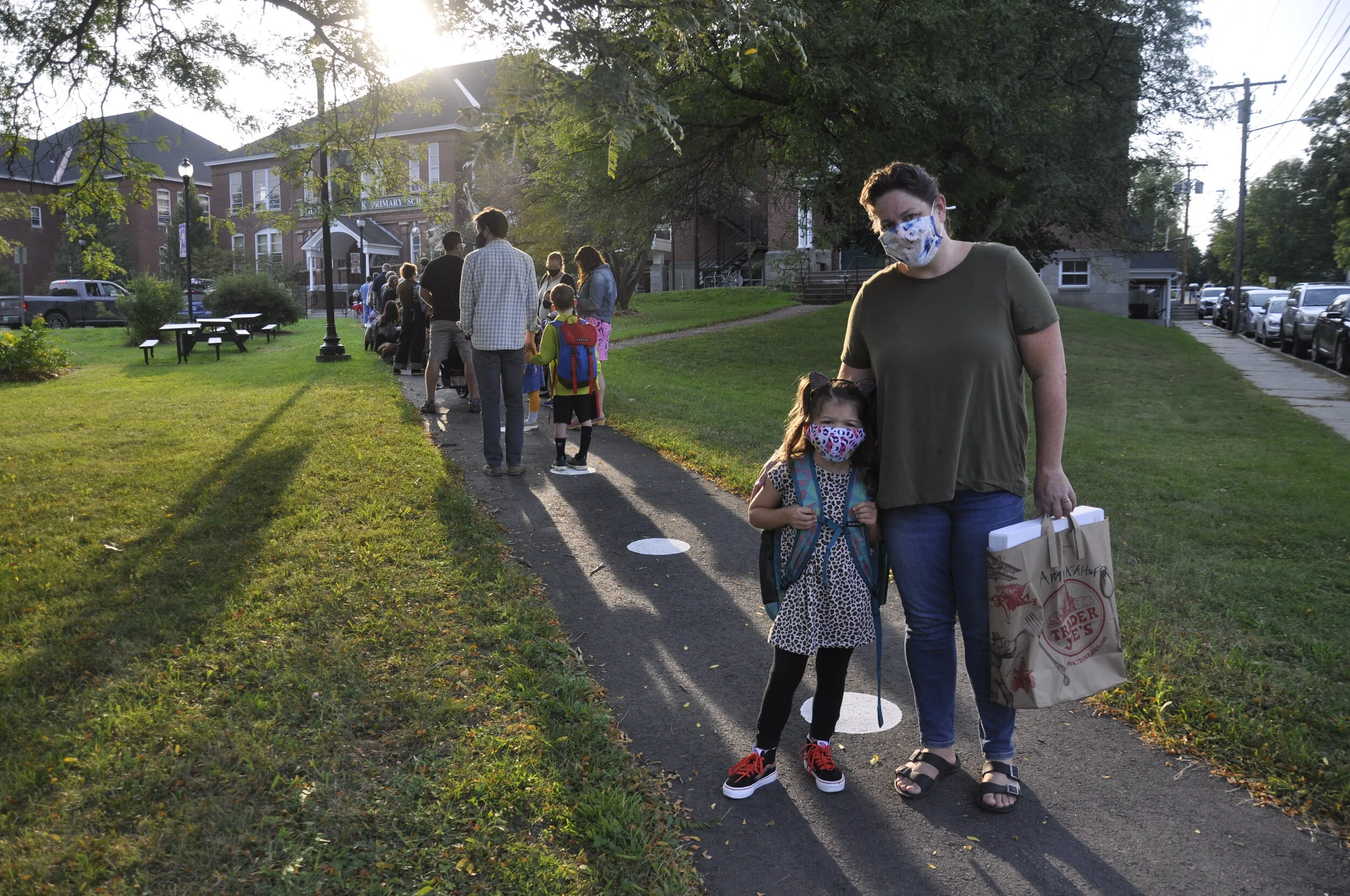   Ruby Simmers is ready for her first day of kindergarten with Ms Hammett as she waits in line with her mom Lauren. Photo by Lisa Scagliotti.  