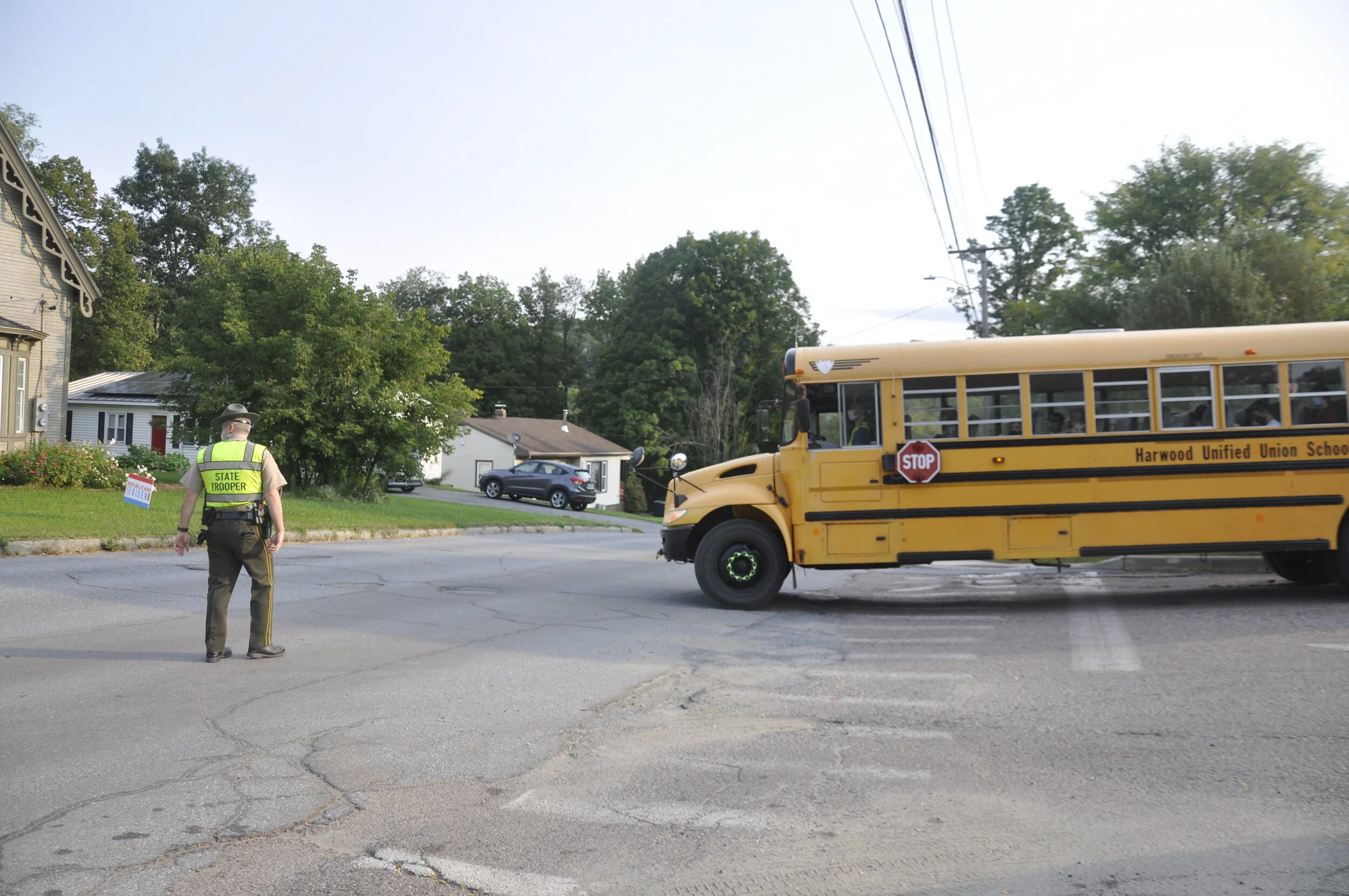   Vermont State Trooper Keith Lewia joined the morning arrival to assist with traffic flow on Stowe Street. Photo by Lisa Scagliotti.  