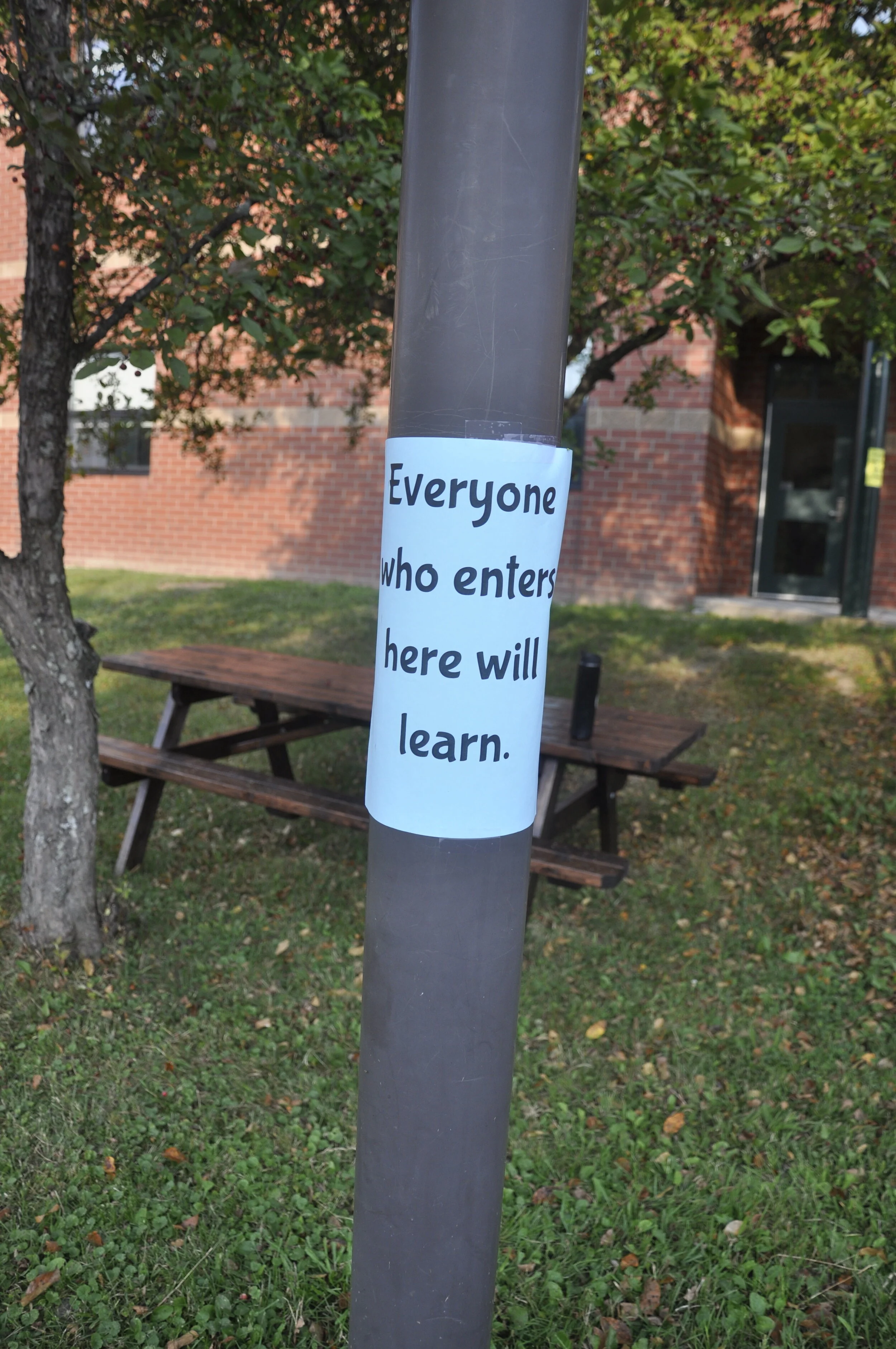   Short messages posted around the school grounds greet students Tuesday morning. Photo by Lisa Scagliotti.  