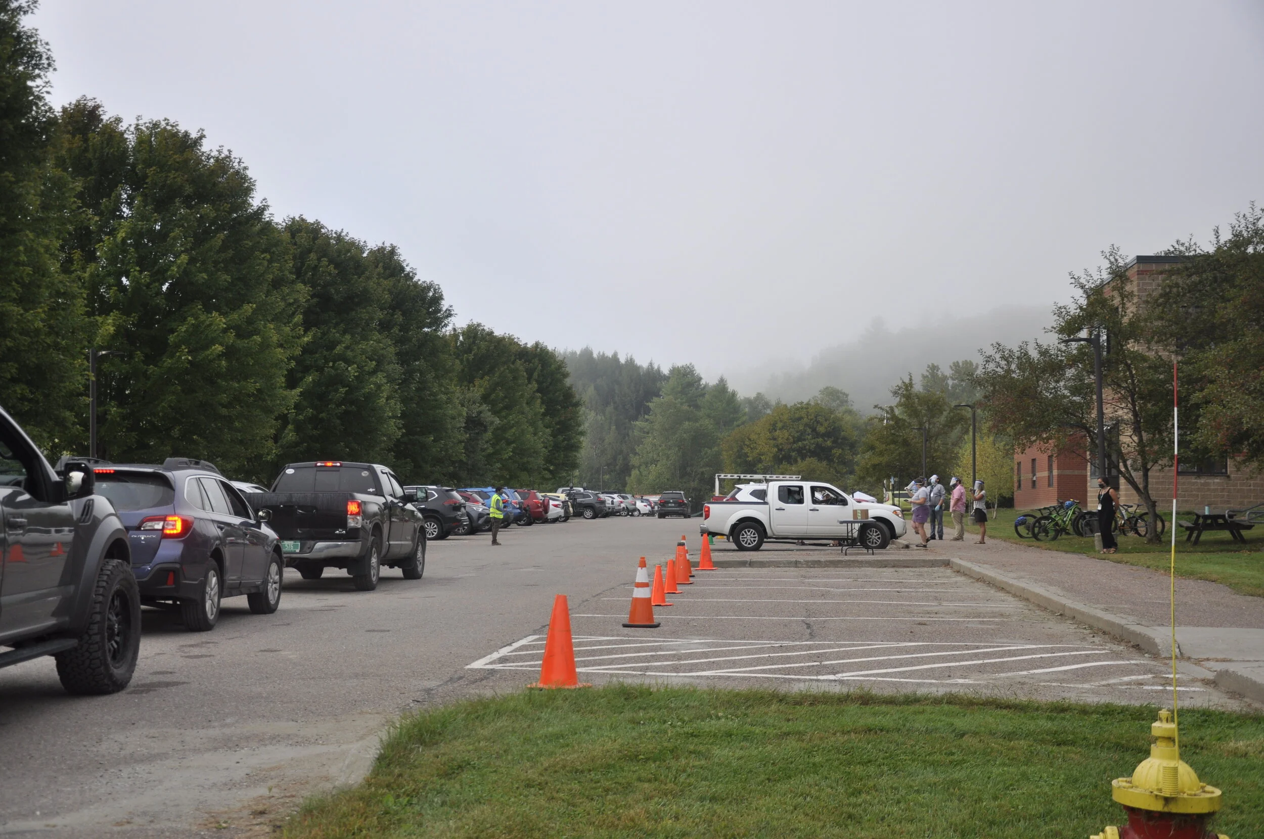   Staff tried a different screening lineup Thursday with parent vehicles pulling into parking spots. Photo by Lisa Scagliotti.  